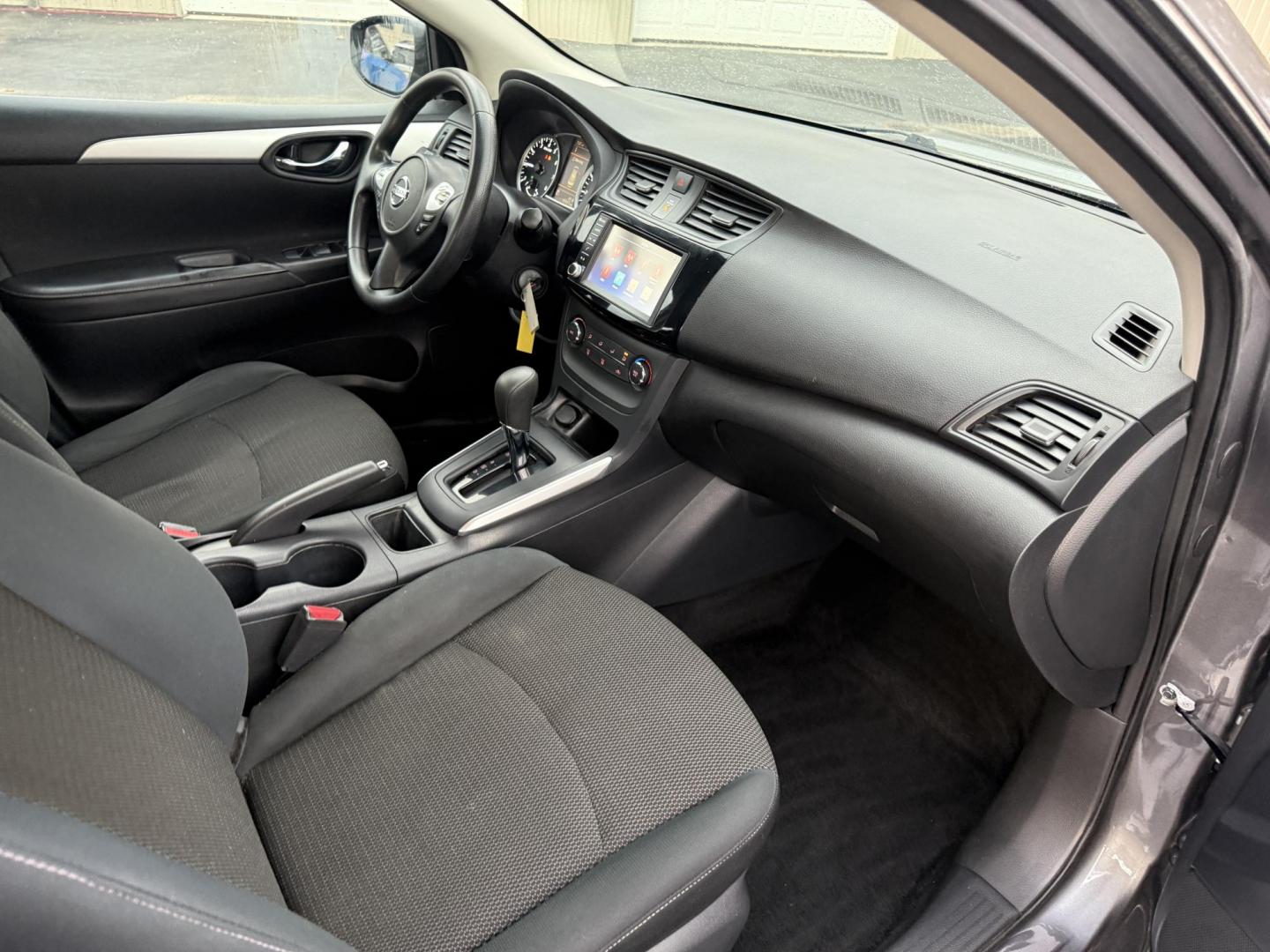 2019 Gray /Black Nissan Sentra S CVT (3N1AB7APXKY) with an 1.8L I4 SFI DOHC 16V engine, Automatic transmission, located at 547 E. Main St., Orwell, OH, 44076, (440) 437-5893, 41.535435, -80.847855 - ONE OWNER – 2019 Nissan Sentra S – Exceptional Efficiency, Modern Tech, and Everyday Confidence Drive smart and save with this 2019 Nissan Sentra S, offering an efficient 1.8L I4 engine that delivers 32 MPG combined and up to 37 MPG highway. With ECO mode, you’ll maximize every mile—perfe - Photo#35