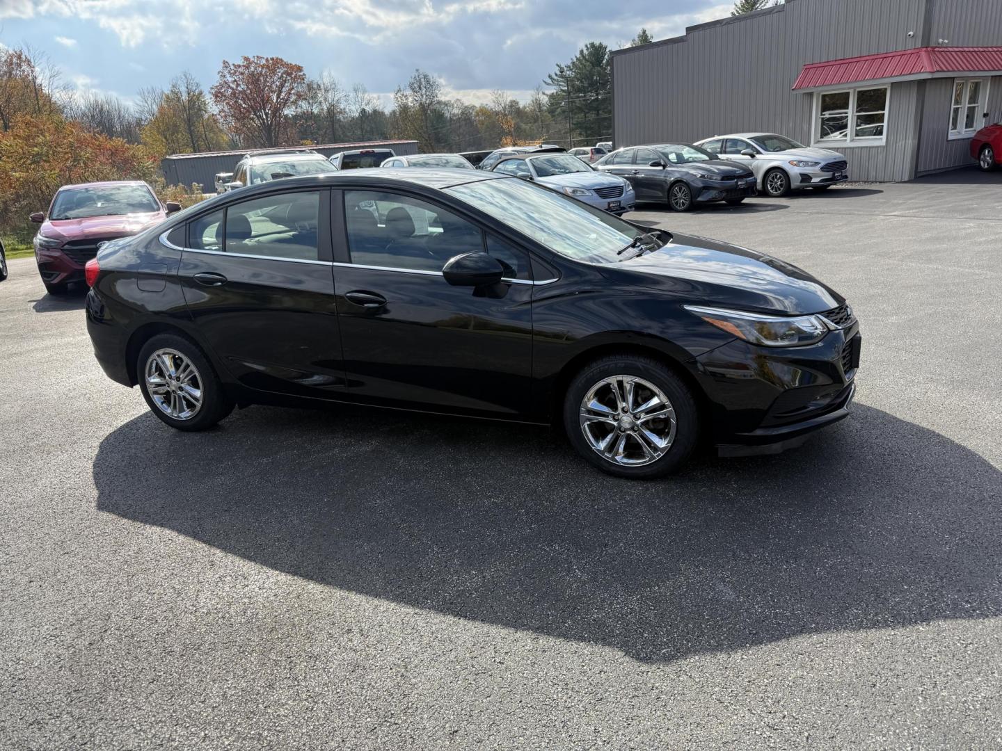 2017 Black /Black Chevrolet Cruze LT Auto (1G1BE5SM6H7) with an 1.4L I4 DOHC 16V TURBO engine, Automatic transmission, located at 11115 Chardon Rd. , Chardon, OH, 44024, (440) 214-9705, 41.580246, -81.241943 - 2017 Chevrolet Cruze LT Auto – Efficient, Stylish, and Tech-Ready Drive with confidence in this 2017 Chevrolet Cruze LT Auto, featuring a turbocharged 1.4L EcoTec engine paired with a smooth 6-speed automatic transmission. Enjoy impressive fuel efficiency with up to 34 MPG combined and 40 MPG h - Photo#3