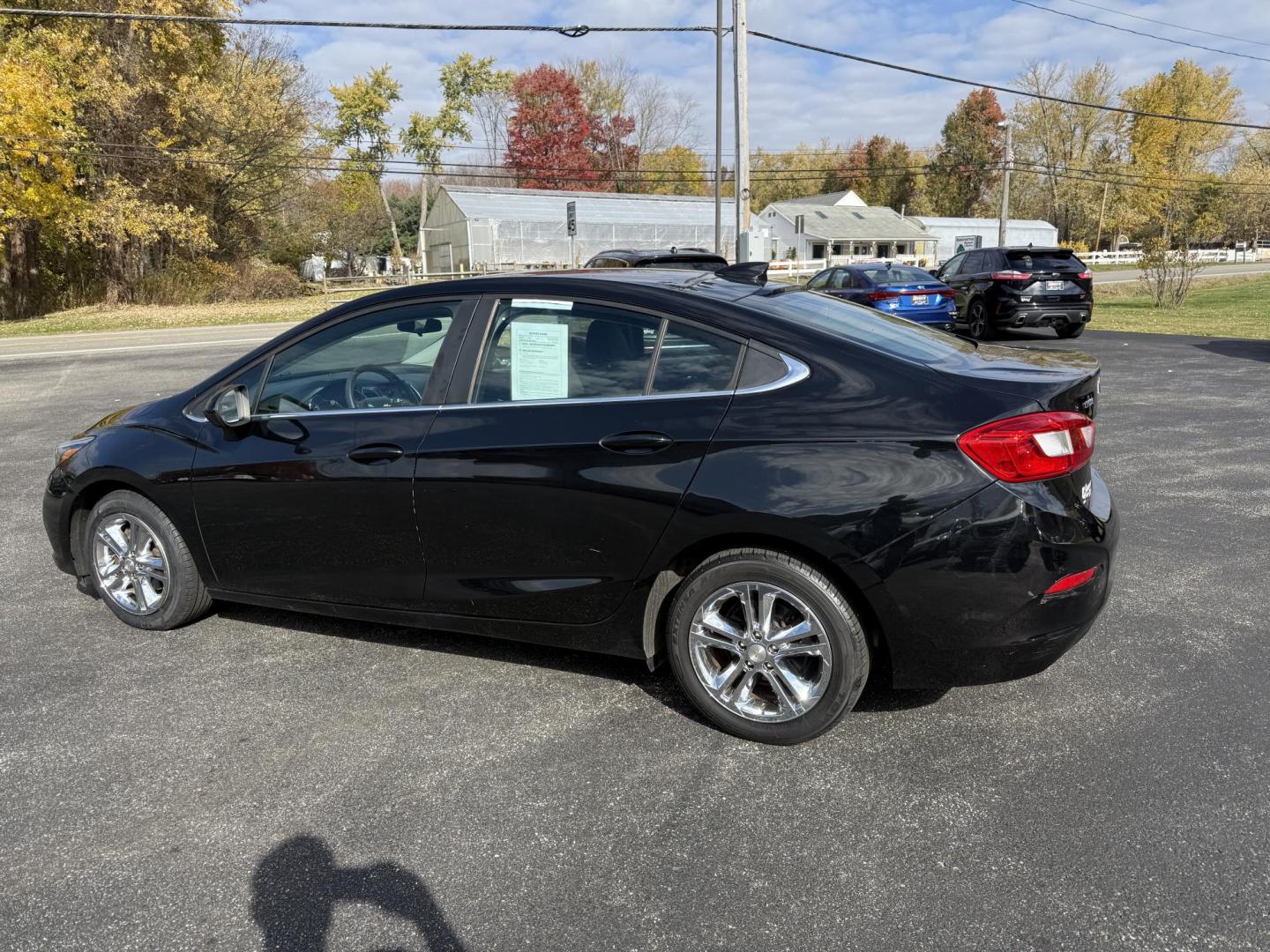 2017 Black /Black Chevrolet Cruze LT Auto (1G1BE5SM6H7) with an 1.4L I4 DOHC 16V TURBO engine, Automatic transmission, located at 11115 Chardon Rd. , Chardon, OH, 44024, (440) 214-9705, 41.580246, -81.241943 - 2017 Chevrolet Cruze LT Auto – Efficient, Stylish, and Tech-Ready Drive with confidence in this 2017 Chevrolet Cruze LT Auto, featuring a turbocharged 1.4L EcoTec engine paired with a smooth 6-speed automatic transmission. Enjoy impressive fuel efficiency with up to 34 MPG combined and 40 MPG h - Photo#10