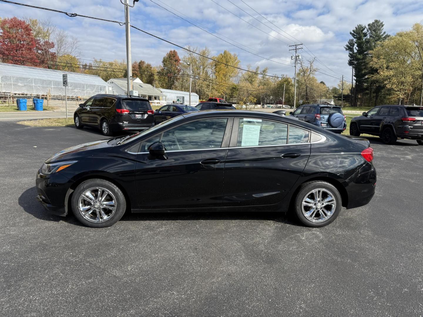 2017 Black /Black Chevrolet Cruze LT Auto (1G1BE5SM6H7) with an 1.4L I4 DOHC 16V TURBO engine, Automatic transmission, located at 11115 Chardon Rd. , Chardon, OH, 44024, (440) 214-9705, 41.580246, -81.241943 - 2017 Chevrolet Cruze LT Auto – Efficient, Stylish, and Tech-Ready Drive with confidence in this 2017 Chevrolet Cruze LT Auto, featuring a turbocharged 1.4L EcoTec engine paired with a smooth 6-speed automatic transmission. Enjoy impressive fuel efficiency with up to 34 MPG combined and 40 MPG h - Photo#12