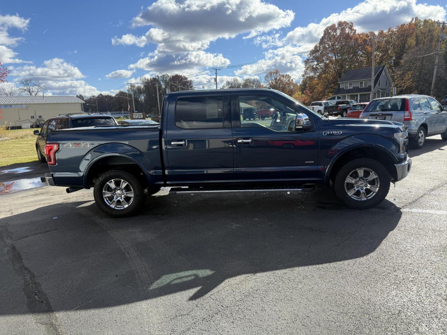 2015 Blue /Black Ford F-150 Lariat SuperCrew 5.5-ft. Bed 4WD (1FTEW1EG2FF) with an 3.5L V6 TWIN TURBO engine, 6-Speed Automatic transmission, located at 547 E. Main St., Orwell, OH, 44076, (440) 437-5893, 41.535435, -80.847855 - 2015 Ford F-150 Lariat Crew Cab – Power, Luxury, and Advanced Capability Experience top-tier performance and premium comfort with this 2015 Ford F-150 Lariat Crew Cab. Under the hood, the powerful 3.5L Twin Turbo EcoBoost engine delivers an impressive 365 horsepower and 420 lb-ft of torque, pai - Photo#6