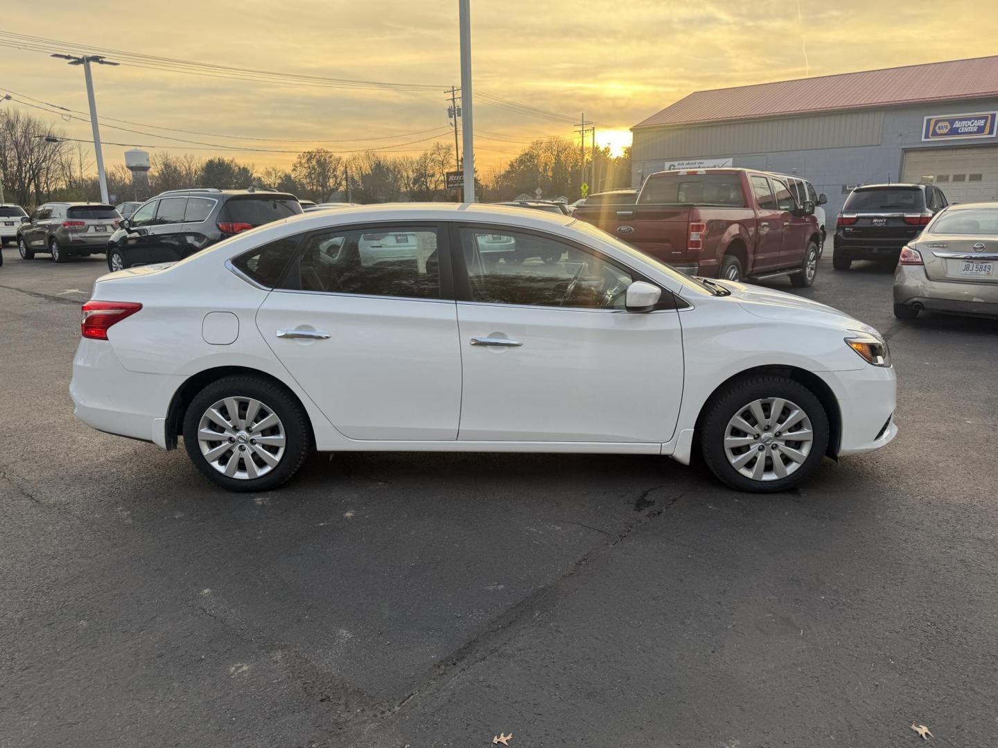 2019 White /Black Nissan Sentra S CVT (3N1AB7AP8KY) with an 1.8L I4 SFI DOHC 16V engine, Automatic transmission, located at 547 E. Main St., Orwell, OH, 44076, (440) 437-5893, 41.535435, -80.847855 - 2019 Nissan Sentra S – Efficient, Safe, and Smartly Equipped Enjoy reliability and impressive efficiency in this 2019 Nissan Sentra S. Powered by a fuel-sipping 1.8L I4 engine with ECO mode, this sedan delivers an outstanding 32 MPG combined and up to 37 MPG highway—making it the ideal choice - Photo#5