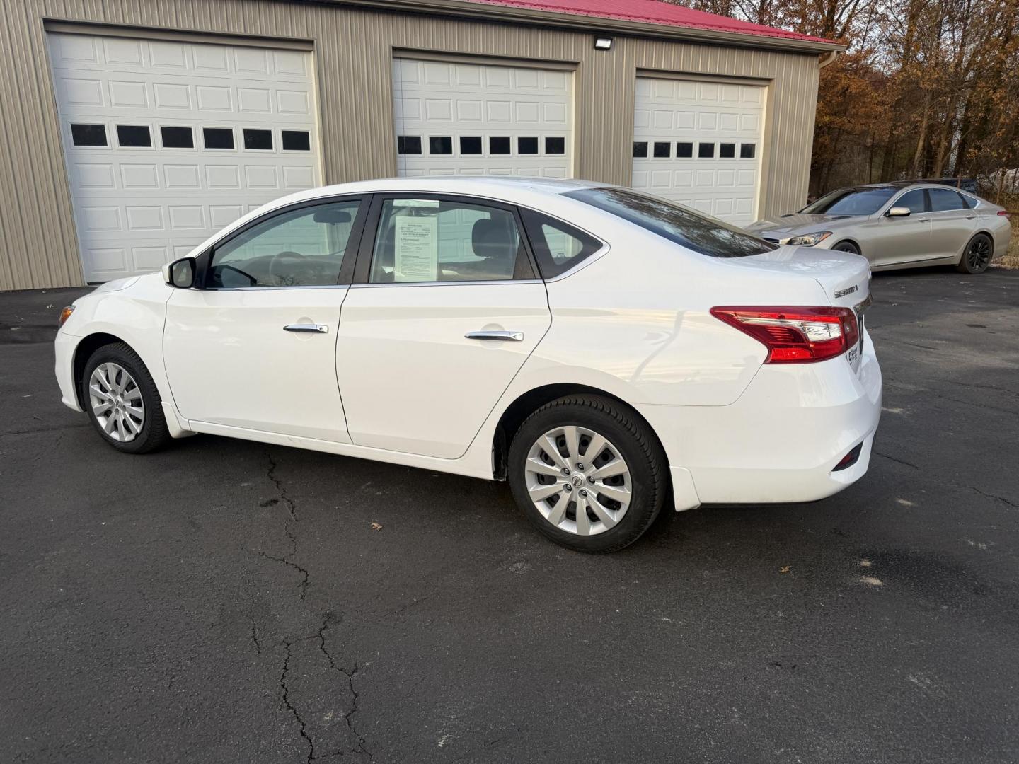 2019 White /Black Nissan Sentra S CVT (3N1AB7AP8KY) with an 1.8L I4 SFI DOHC 16V engine, Automatic transmission, located at 547 E. Main St., Orwell, OH, 44076, (440) 437-5893, 41.535435, -80.847855 - 2019 Nissan Sentra S – Efficient, Safe, and Smartly Equipped Enjoy reliability and impressive efficiency in this 2019 Nissan Sentra S. Powered by a fuel-sipping 1.8L I4 engine with ECO mode, this sedan delivers an outstanding 32 MPG combined and up to 37 MPG highway—making it the ideal choice - Photo#10