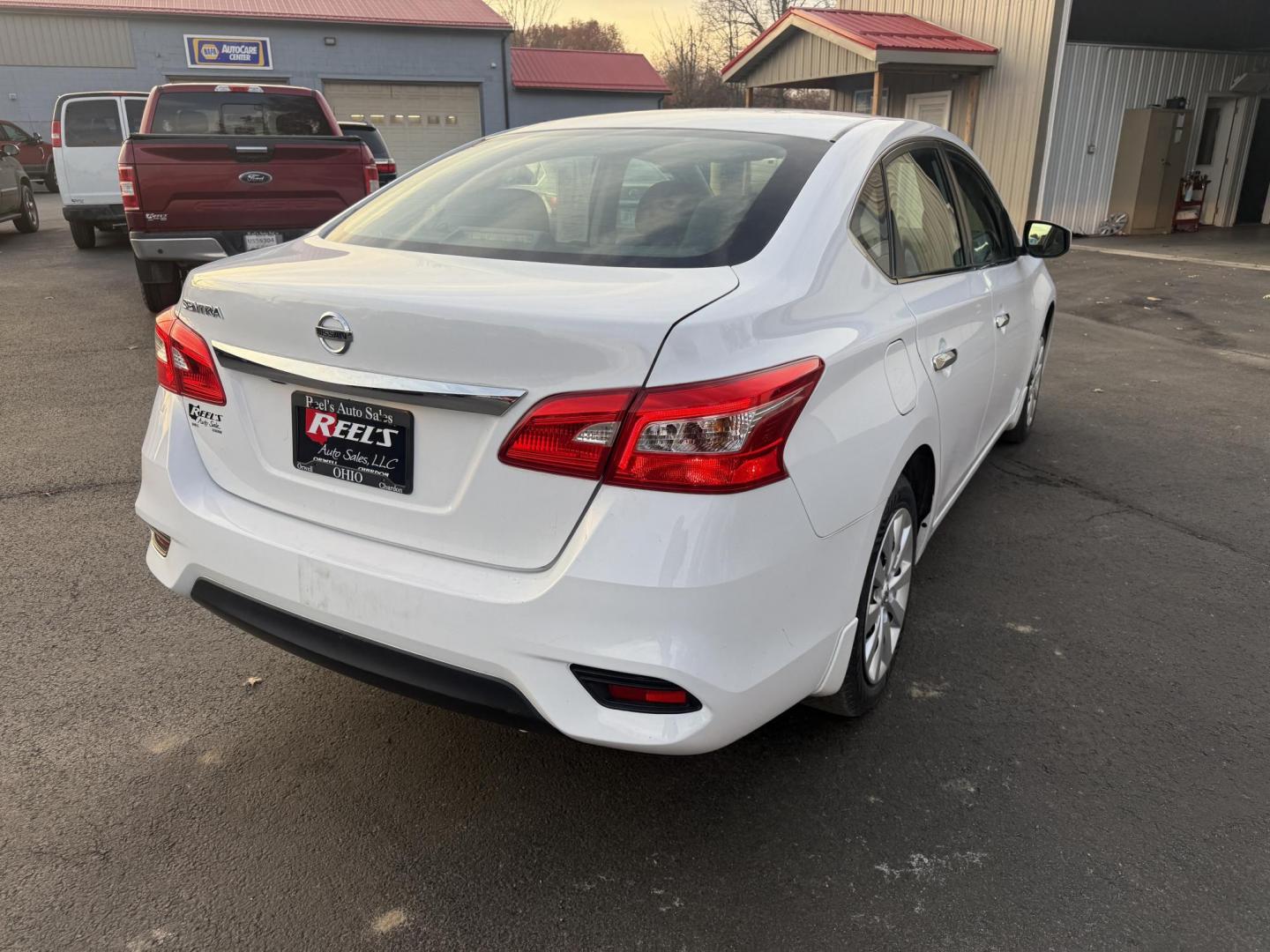 2019 White /Black Nissan Sentra S CVT (3N1AB7AP8KY) with an 1.8L I4 SFI DOHC 16V engine, Automatic transmission, located at 547 E. Main St., Orwell, OH, 44076, (440) 437-5893, 41.535435, -80.847855 - 2019 Nissan Sentra S – Efficient, Safe, and Smartly Equipped Enjoy reliability and impressive efficiency in this 2019 Nissan Sentra S. Powered by a fuel-sipping 1.8L I4 engine with ECO mode, this sedan delivers an outstanding 32 MPG combined and up to 37 MPG highway—making it the ideal choice - Photo#7