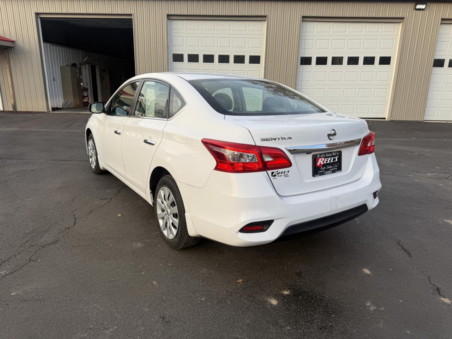 2019 White /Black Nissan Sentra S CVT (3N1AB7AP8KY) with an 1.8L I4 SFI DOHC 16V engine, Automatic transmission, located at 547 E. Main St., Orwell, OH, 44076, (440) 437-5893, 41.535435, -80.847855 - 2019 Nissan Sentra S – Efficient, Safe, and Smartly Equipped Enjoy reliability and impressive efficiency in this 2019 Nissan Sentra S. Powered by a fuel-sipping 1.8L I4 engine with ECO mode, this sedan delivers an outstanding 32 MPG combined and up to 37 MPG highway—making it the ideal choice - Photo#9