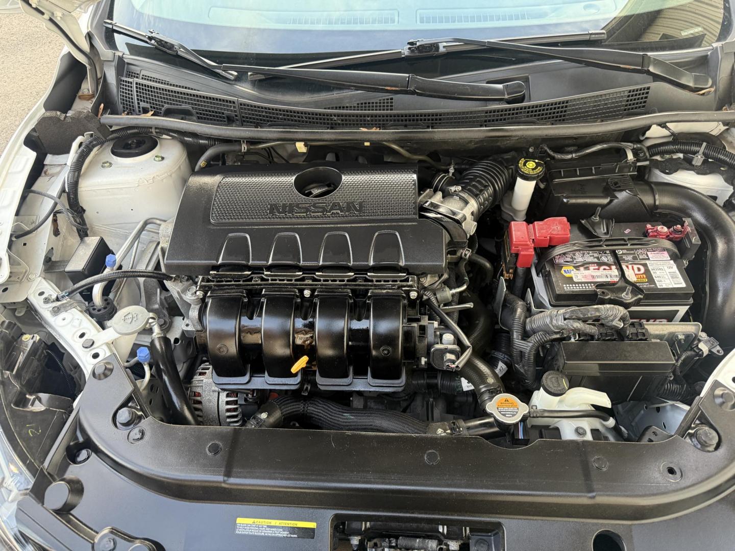 2019 White /Black Nissan Sentra S CVT (3N1AB7AP8KY) with an 1.8L I4 SFI DOHC 16V engine, Automatic transmission, located at 547 E. Main St., Orwell, OH, 44076, (440) 437-5893, 41.535435, -80.847855 - 2019 Nissan Sentra S – Efficient, Safe, and Smartly Equipped Enjoy reliability and impressive efficiency in this 2019 Nissan Sentra S. Powered by a fuel-sipping 1.8L I4 engine with ECO mode, this sedan delivers an outstanding 32 MPG combined and up to 37 MPG highway—making it the ideal choice - Photo#14