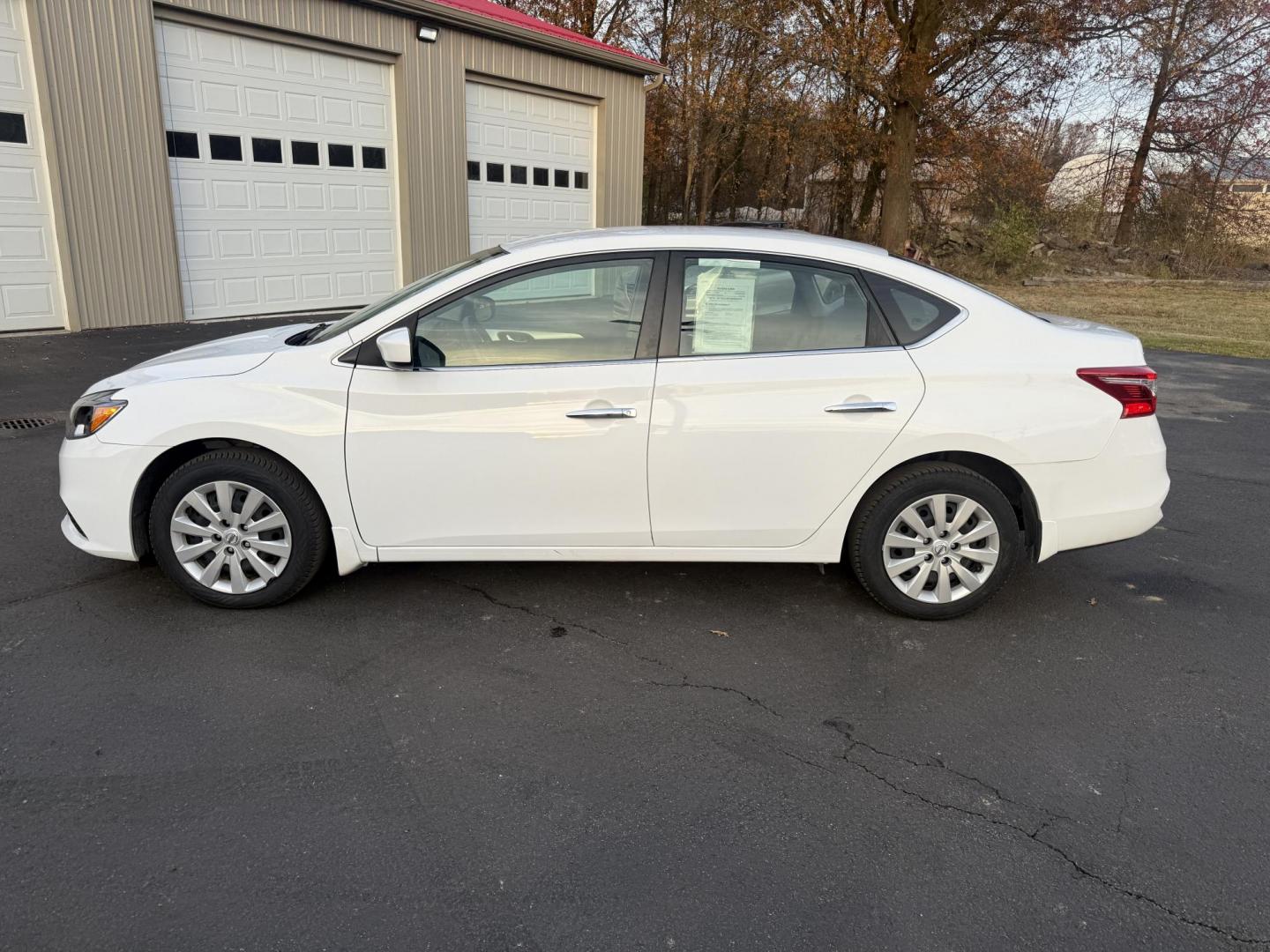 2019 White /Black Nissan Sentra S CVT (3N1AB7AP8KY) with an 1.8L I4 SFI DOHC 16V engine, Automatic transmission, located at 547 E. Main St., Orwell, OH, 44076, (440) 437-5893, 41.535435, -80.847855 - 2019 Nissan Sentra S – Efficient, Safe, and Smartly Equipped Enjoy reliability and impressive efficiency in this 2019 Nissan Sentra S. Powered by a fuel-sipping 1.8L I4 engine with ECO mode, this sedan delivers an outstanding 32 MPG combined and up to 37 MPG highway—making it the ideal choice - Photo#12
