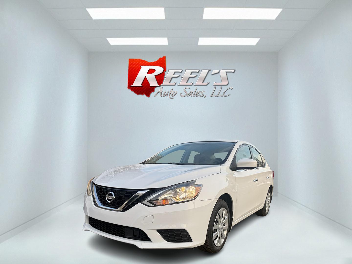 2019 White /Black Nissan Sentra S CVT (3N1AB7AP8KY) with an 1.8L I4 SFI DOHC 16V engine, Automatic transmission, located at 547 E. Main St., Orwell, OH, 44076, (440) 437-5893, 41.535435, -80.847855 - 2019 Nissan Sentra S – Efficient, Safe, and Smartly Equipped Enjoy reliability and impressive efficiency in this 2019 Nissan Sentra S. Powered by a fuel-sipping 1.8L I4 engine with ECO mode, this sedan delivers an outstanding 32 MPG combined and up to 37 MPG highway—making it the ideal choice - Photo#0