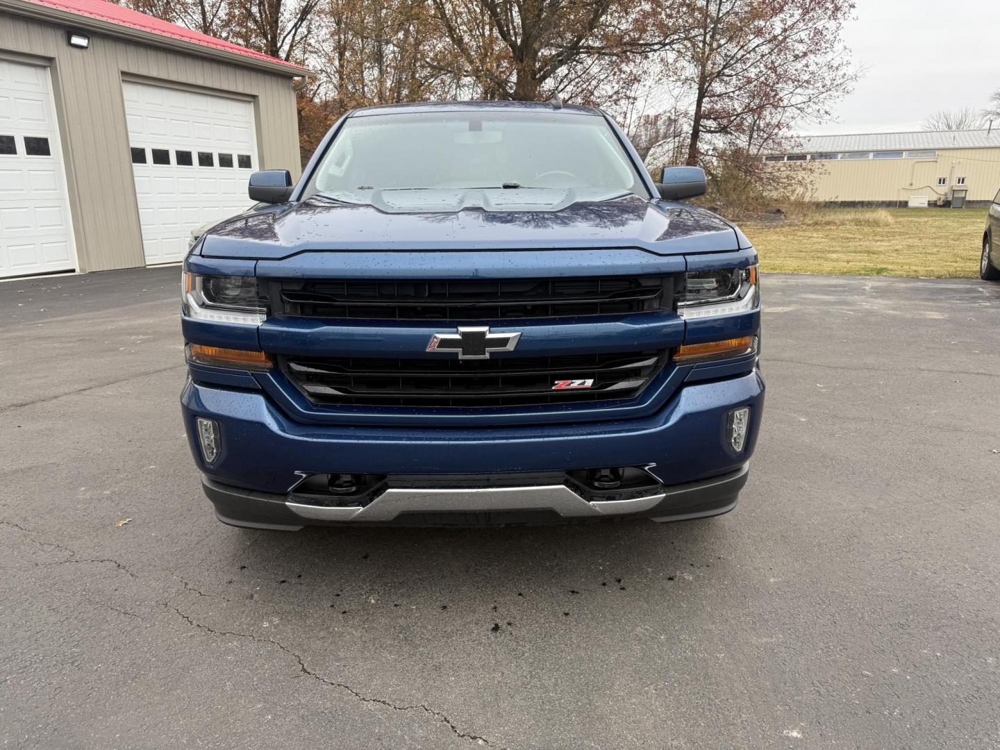 2018 Blue /Black Chevrolet Silverado 1500 LT Z71 Double Cab 4WD (1GCVKREC2JZ) with an 5.3L V8 OHV 16V engine, Automatic transmission, located at 547 E. Main St., Orwell, OH, 44076, (440) 437-5893, 41.535435, -80.847855 - 2018 Chevrolet Silverado 1500 LT Z71 Double Cab 4WD – Power, Luxury, and Off-Road Capability in One Bold Package Conquer any road or trail with this 2018 Chevrolet Silverado 1500 LT Z71 Double Cab 4WD. Under the hood, the formidable 5.3L EcoTec3 V8 engine pairs with a 6-speed automatic transmis - Photo#1
