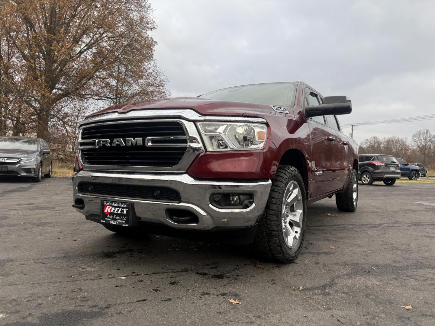 2019 Red /Black RAM 1500 Big Horn Crew Cab SWB 4WD (1C6SRFFT5KN) with an 5.7L V8 OHV 16V engine, Automatic transmission, located at 547 E. Main St., Orwell, OH, 44076, (440) 437-5893, 41.535435, -80.847855 - 2019 Ram 1500 Big Horn Crew Cab 4WD – Bold Power, Premium Comfort, and Rugged Capability Take command of the road with this 2019 Ram 1500 Big Horn Crew Cab 4WD. Powered by the legendary 5.7L HEMI V8 engine delivering 395 horsepower and 410 lb-ft of torque, this truck is built to tackle any task - Photo#0