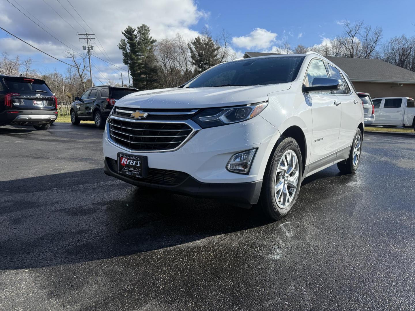 2018 White /Black Chevrolet Equinox Premier AWD (3GNAXVEVXJL) with an 1.5L I4 DIR DOHC 16V TURBO engine, Automatic transmission, located at 11115 Chardon Rd. , Chardon, OH, 44024, (440) 214-9705, 41.580246, -81.241943 - One Owner --- 2018 Chevrolet Equinox Premier AWD – Luxurious Comfort, Advanced Safety, and Unmatched Efficiency Experience the perfect combination of style, safety, and technology with this 2018 Chevrolet Equinox Premier AWD. Powered by a fuel-efficient 1.5L Turbocharged EcoTec I4 engine paired - Photo#0