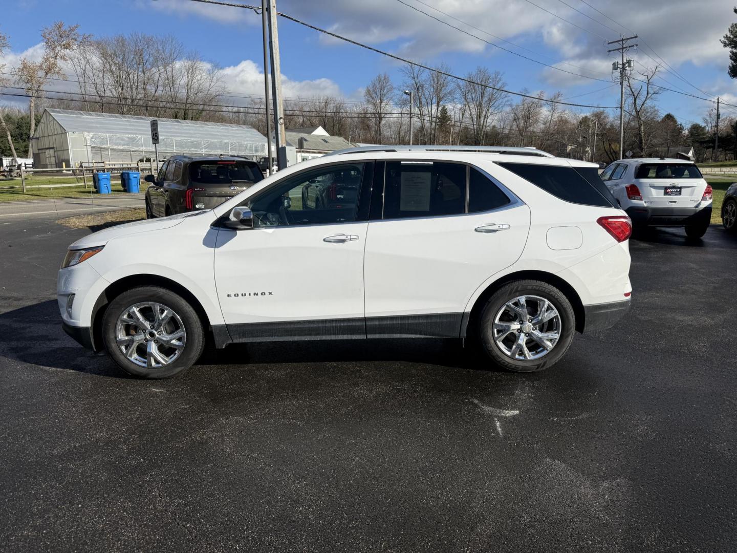 2018 White /Black Chevrolet Equinox Premier AWD (3GNAXVEVXJL) with an 1.5L I4 DIR DOHC 16V TURBO engine, Automatic transmission, located at 11115 Chardon Rd. , Chardon, OH, 44024, (440) 214-9705, 41.580246, -81.241943 - One Owner --- 2018 Chevrolet Equinox Premier AWD – Luxurious Comfort, Advanced Safety, and Unmatched Efficiency Experience the perfect combination of style, safety, and technology with this 2018 Chevrolet Equinox Premier AWD. Powered by a fuel-efficient 1.5L Turbocharged EcoTec I4 engine paired - Photo#12