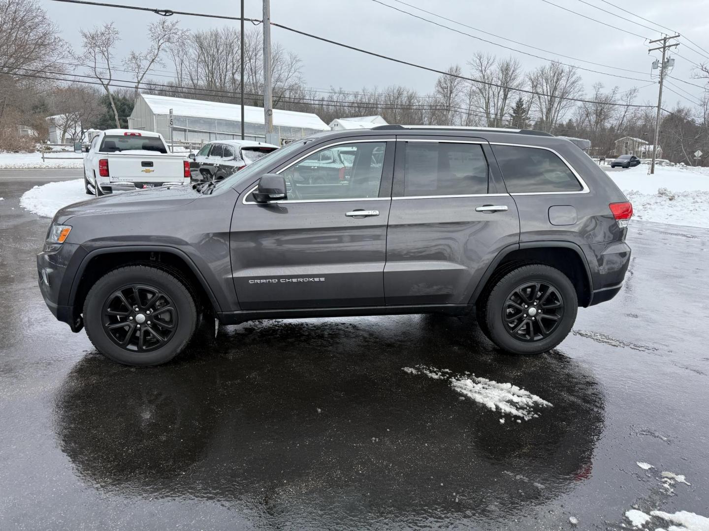 2014 Gray /Black Jeep Grand Cherokee Limited 4WD (1C4RJFBG0EC) with an 3.6L V6 DOHC 24V FFV engine, Automatic transmission, located at 11115 Chardon Rd. , Chardon, OH, 44024, (440) 214-9705, 41.580246, -81.241943 - Photo#12