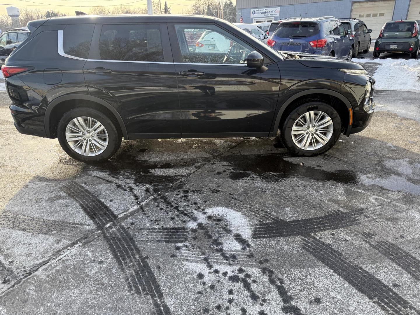 2022 Black /Black Mitsubishi Outlander ES 4WD (JA4J4TA82NZ) with an 2.5L I4 DOHC 16V engine, Automatic transmission, located at 547 E. Main St., Orwell, OH, 44076, (440) 437-5893, 41.535435, -80.847855 - Photo#3