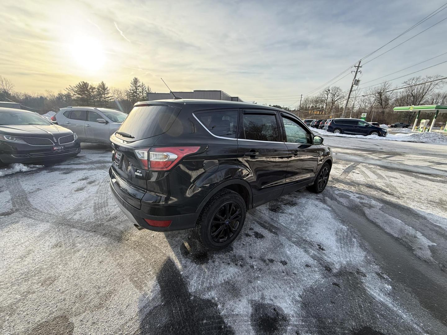2017 Black /Black Ford Escape SE 4WD (1FMCU9GDXHU) with an 1.5L I4 DOHC 16V Turbo engine, Automatic transmission, located at 11115 Chardon Rd. , Chardon, OH, 44024, (440) 214-9705, 41.580246, -81.241943 - 2017 Ford Escape SE 4WD – Versatile Efficiency, Comfort, and Confidence Upgrade your daily drive with this 2017 Ford Escape SE 4WD, combining smart features and practical performance. Powered by a responsive 1.5L turbocharged EcoTec I4 engine with a 6-speed automatic transmission, this SUV deli - Photo#4