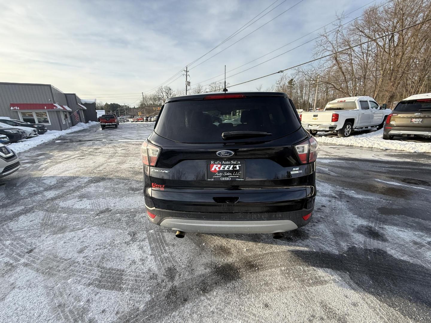 2017 Black /Black Ford Escape SE 4WD (1FMCU9GDXHU) with an 1.5L I4 DOHC 16V Turbo engine, Automatic transmission, located at 11115 Chardon Rd. , Chardon, OH, 44024, (440) 214-9705, 41.580246, -81.241943 - 2017 Ford Escape SE 4WD – Versatile Efficiency, Comfort, and Confidence Upgrade your daily drive with this 2017 Ford Escape SE 4WD, combining smart features and practical performance. Powered by a responsive 1.5L turbocharged EcoTec I4 engine with a 6-speed automatic transmission, this SUV deli - Photo#5