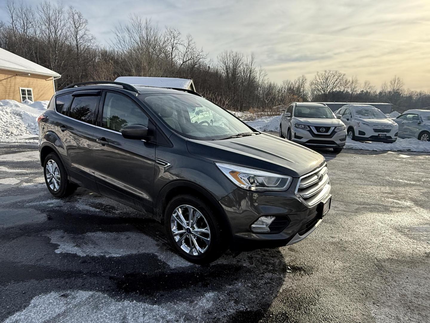 2019 Gray /Gray Ford Escape SEL 4WD (1FMCU9HDXKU) with an 1.5L I4 DOHC 16V Turbo engine, Automatic transmission, located at 11115 Chardon Rd. , Chardon, OH, 44024, (440) 214-9705, 41.580246, -81.241943 - 2019 Ford Escape SEL 4WD – Stylish Comfort, Advanced Safety, and Efficient Performance Elevate your driving experience with this 2019 Ford Escape SEL 4WD. Powered by a fuel-efficient 1.5L turbocharged EcoTec I4 engine and a smooth 6-speed automatic transmission, this SUV delivers up to 28 MPG h - Photo#2