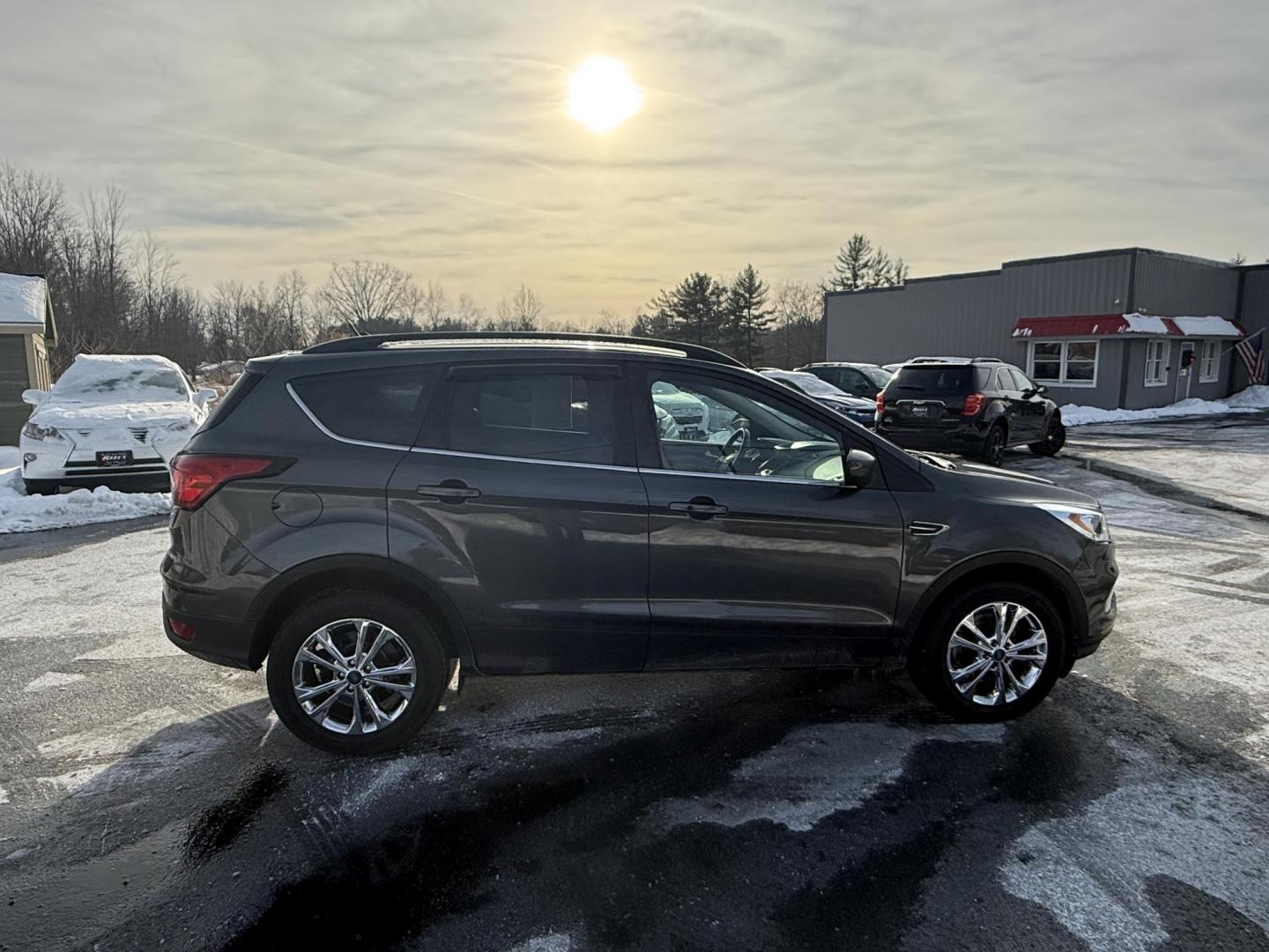 2019 Gray /Gray Ford Escape SEL 4WD (1FMCU9HDXKU) with an 1.5L I4 DOHC 16V Turbo engine, Automatic transmission, located at 11115 Chardon Rd. , Chardon, OH, 44024, (440) 214-9705, 41.580246, -81.241943 - 2019 Ford Escape SEL 4WD – Stylish Comfort, Advanced Safety, and Efficient Performance Elevate your driving experience with this 2019 Ford Escape SEL 4WD. Powered by a fuel-efficient 1.5L turbocharged EcoTec I4 engine and a smooth 6-speed automatic transmission, this SUV delivers up to 28 MPG h - Photo#3