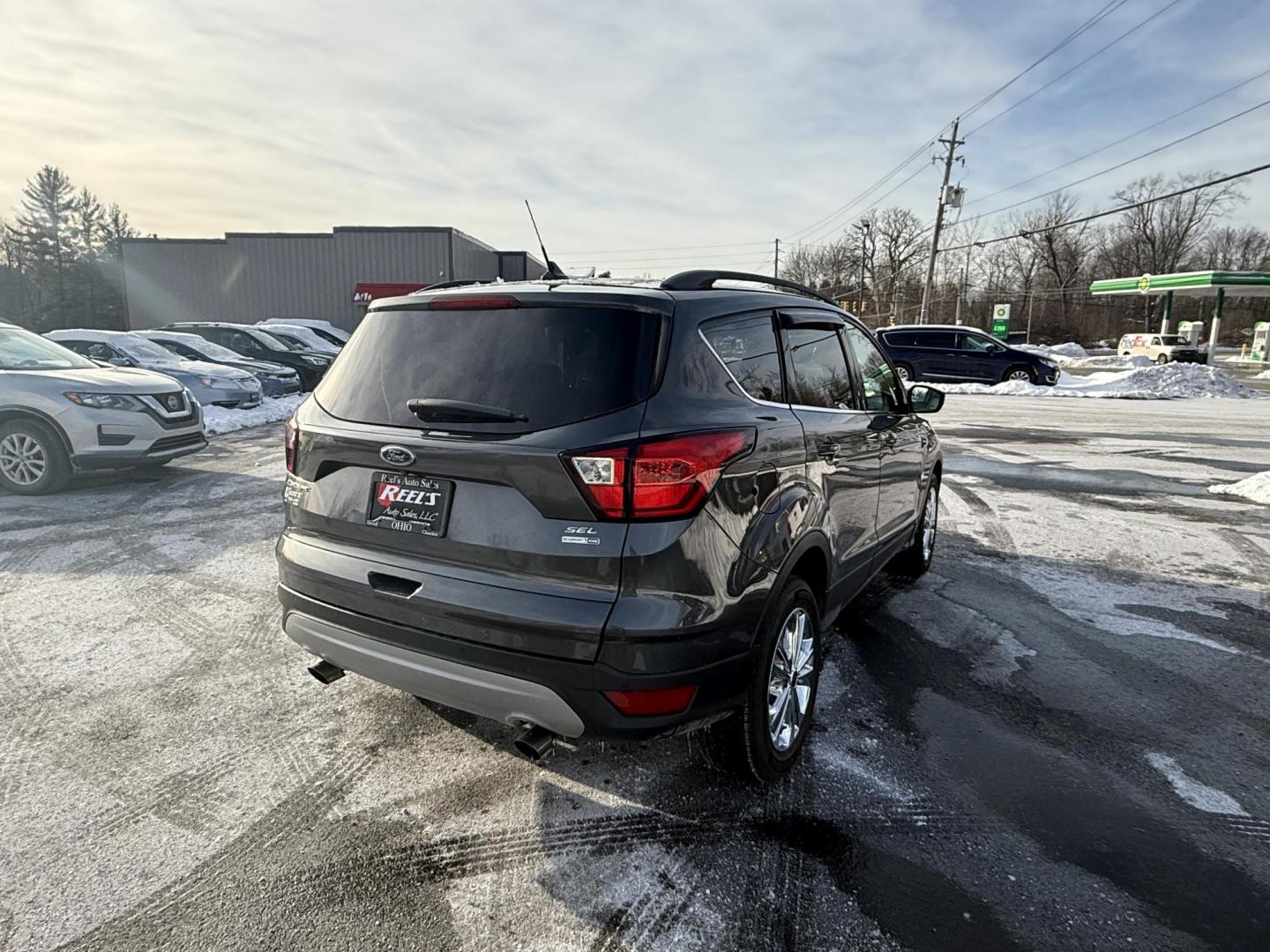 2019 Gray /Gray Ford Escape SEL 4WD (1FMCU9HDXKU) with an 1.5L I4 DOHC 16V Turbo engine, Automatic transmission, located at 11115 Chardon Rd. , Chardon, OH, 44024, (440) 214-9705, 41.580246, -81.241943 - 2019 Ford Escape SEL 4WD – Stylish Comfort, Advanced Safety, and Efficient Performance Elevate your driving experience with this 2019 Ford Escape SEL 4WD. Powered by a fuel-efficient 1.5L turbocharged EcoTec I4 engine and a smooth 6-speed automatic transmission, this SUV delivers up to 28 MPG h - Photo#4