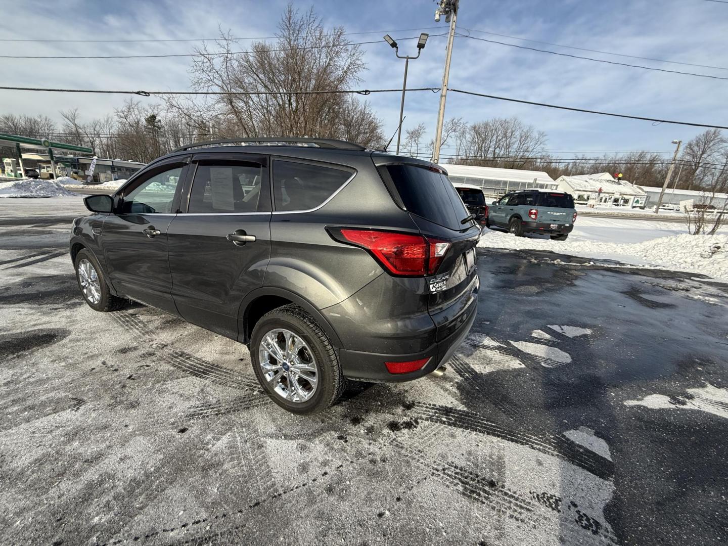 2019 Gray /Gray Ford Escape SEL 4WD (1FMCU9HDXKU) with an 1.5L I4 DOHC 16V Turbo engine, Automatic transmission, located at 11115 Chardon Rd. , Chardon, OH, 44024, (440) 214-9705, 41.580246, -81.241943 - 2019 Ford Escape SEL 4WD – Stylish Comfort, Advanced Safety, and Efficient Performance Elevate your driving experience with this 2019 Ford Escape SEL 4WD. Powered by a fuel-efficient 1.5L turbocharged EcoTec I4 engine and a smooth 6-speed automatic transmission, this SUV delivers up to 28 MPG h - Photo#7
