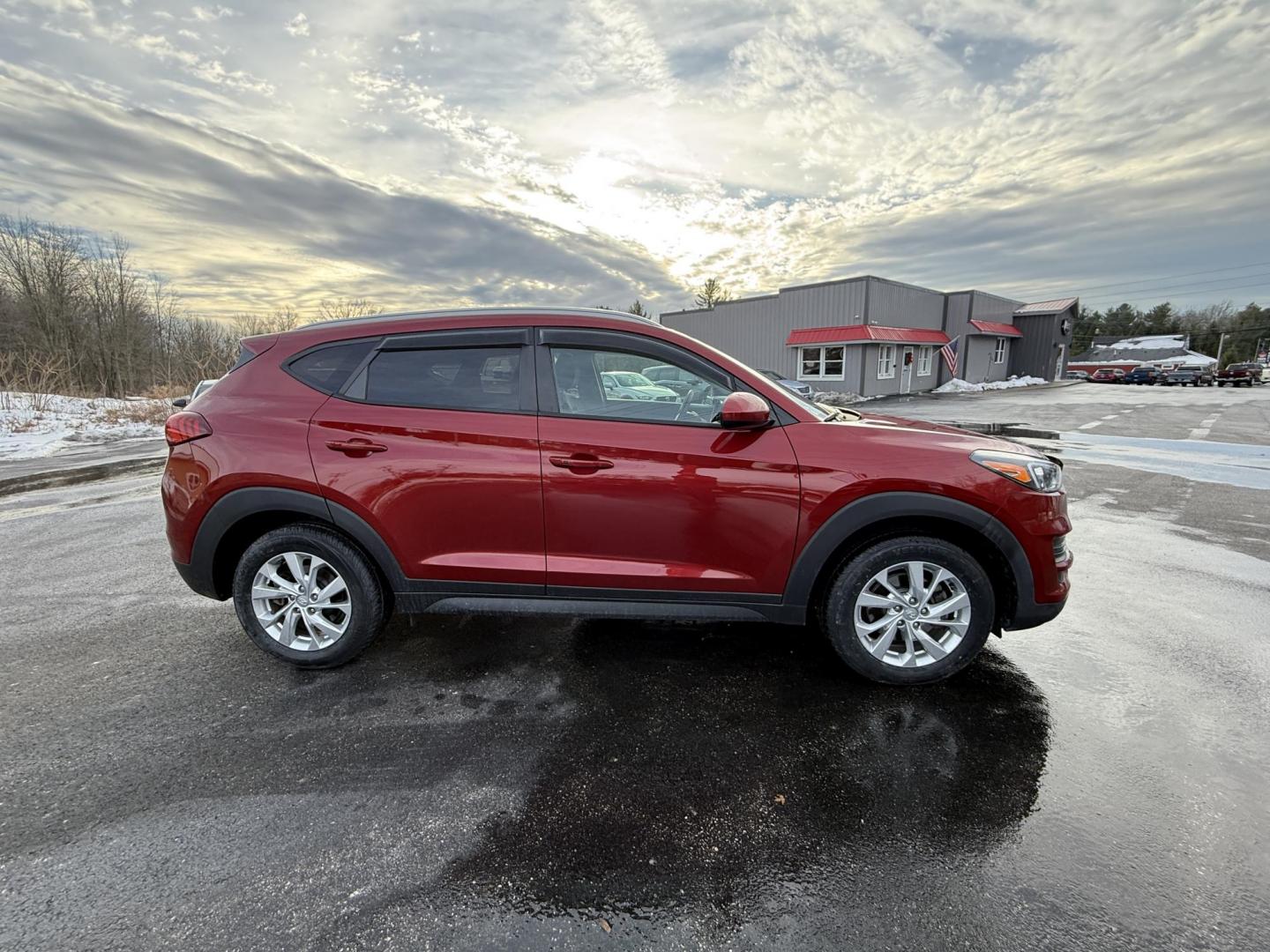 2021 Red /Black Hyundai Tucson Value AWD (KM8J3CA47MU) with an 2.0L I4 DOHC 16V engine, Automatic transmission, located at 11115 Chardon Rd. , Chardon, OH, 44024, (440) 214-9705, 41.580246, -81.241943 - 2021 Hyundai Tucson Value AWD – Advanced Safety, Modern Comfort, and All-Weather Capability Discover the perfect combination of reliability, technology, and comfort with this 2021 Hyundai Tucson Value AWD. Powered by a fuel-efficient 2.0L I4 GDI engine and a smooth 6-speed automatic transmissio - Photo#3