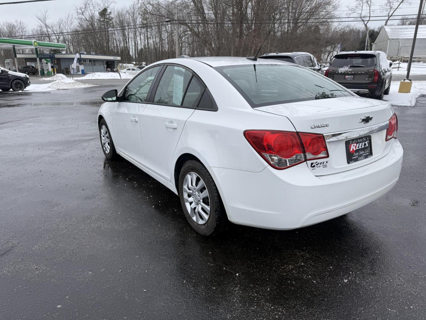 2014 White /Black Chevrolet Cruze LS Auto (1G1PA5SH9E7) with an 1.8L I4 DOHC 16V engine, Automatic transmission, located at 11115 Chardon Rd. , Chardon, OH, 44024, (440) 214-9705, 41.580246, -81.241943 - 2014 Chevrolet Cruze LS – Efficient, Safe, and Dependable Compact Sedan Enjoy reliable performance and impressive fuel economy with this 2014 Chevrolet Cruze LS. Powered by a 1.8L EcoTec I4 engine paired with a 6-speed automatic transmission, this sedan delivers up to 32 MPG highway and 26 MPG - Photo#9