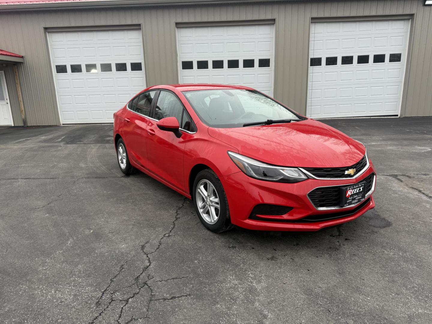 2017 Red /Black Chevrolet Cruze LT Auto (1G1BE5SM0H7) with an 1.4L I4 DOHC 16V TURBO engine, Automatic transmission, located at 547 E. Main St., Orwell, OH, 44076, (440) 437-5893, 41.535435, -80.847855 - Photo#2