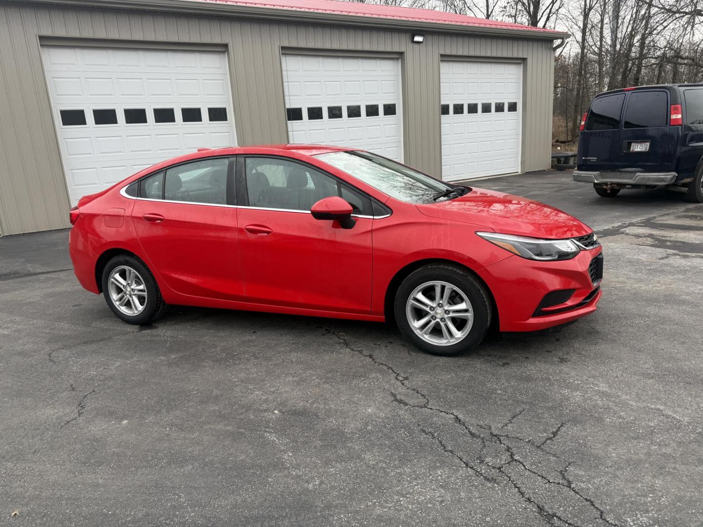 2017 Red /Black Chevrolet Cruze LT Auto (1G1BE5SM0H7) with an 1.4L I4 DOHC 16V TURBO engine, Automatic transmission, located at 547 E. Main St., Orwell, OH, 44076, (440) 437-5893, 41.535435, -80.847855 - Photo#3