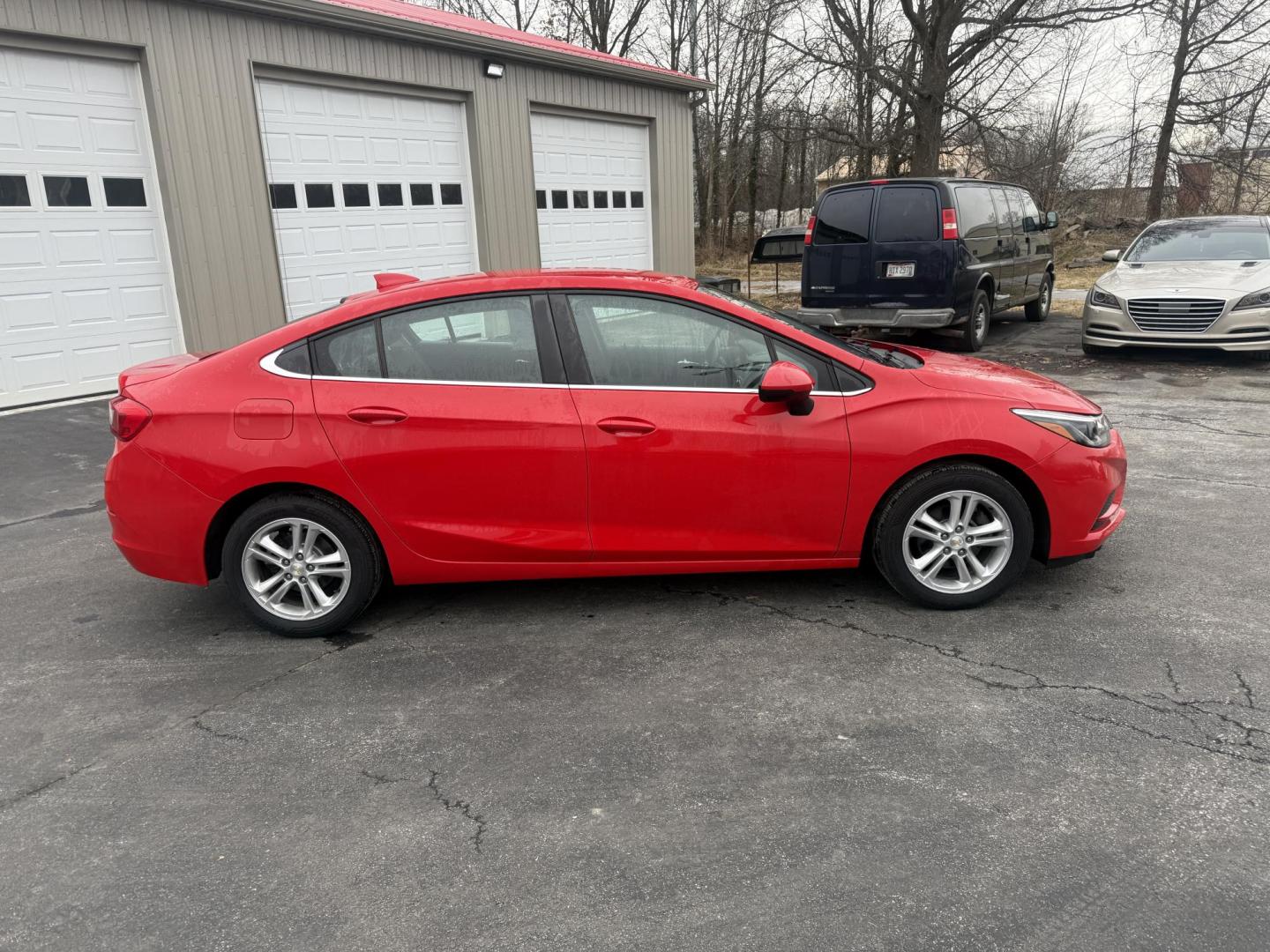 2017 Red /Black Chevrolet Cruze LT Auto (1G1BE5SM0H7) with an 1.4L I4 DOHC 16V TURBO engine, Automatic transmission, located at 547 E. Main St., Orwell, OH, 44076, (440) 437-5893, 41.535435, -80.847855 - Photo#5