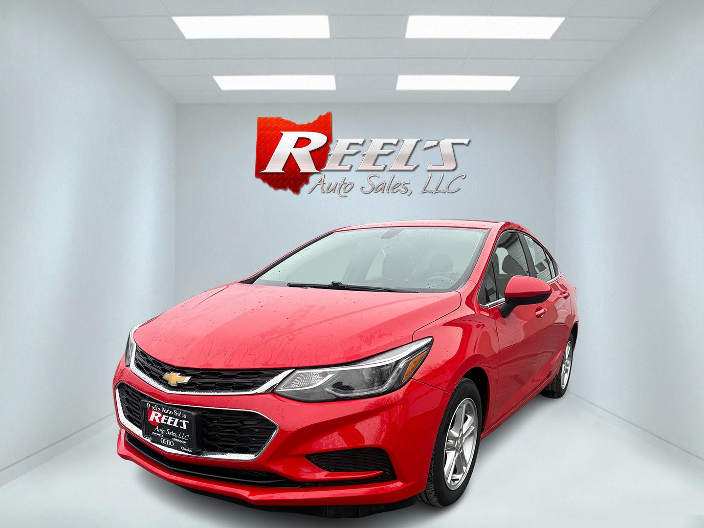 2017 Red /Black Chevrolet Cruze LT Auto (1G1BE5SM0H7) with an 1.4L I4 DOHC 16V TURBO engine, Automatic transmission, located at 547 E. Main St., Orwell, OH, 44076, (440) 437-5893, 41.535435, -80.847855 - Photo#0