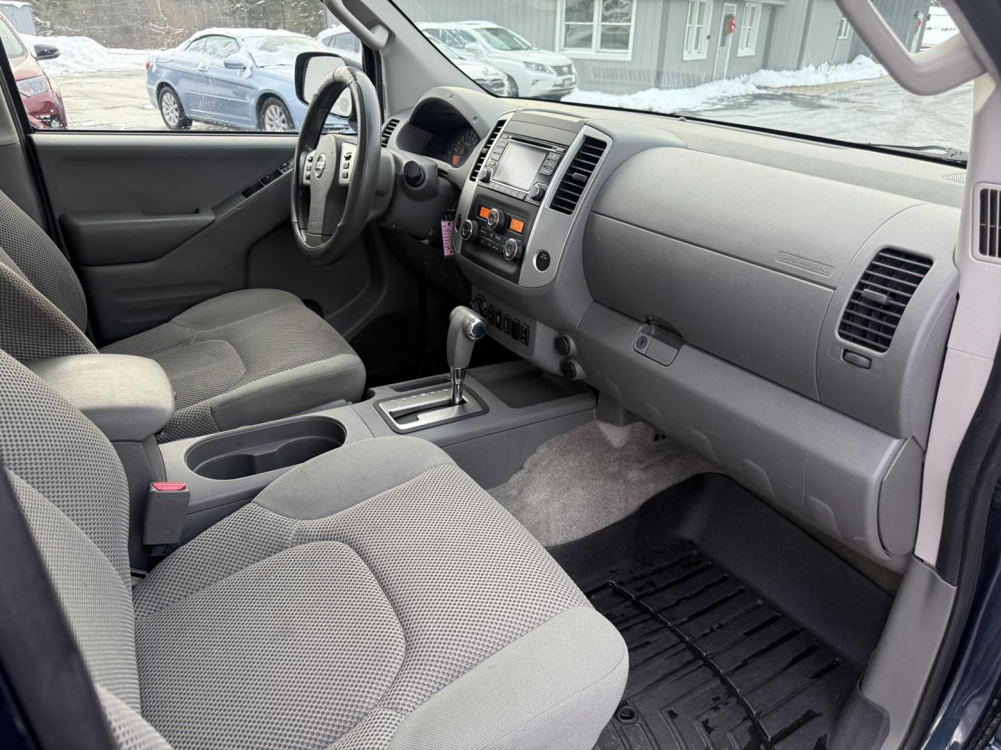 2015 Blue /Gray Nissan Frontier SV Crew Cab 5AT 4WD (1N6AD0EV1FN) with an 4.0L V6 DOHC 24V engine, Automatic transmission, located at 11115 Chardon Rd. , Chardon, OH, 44024, (440) 214-9705, 41.580246, -81.241943 - One Owner ---- 2015 Nissan Frontier SV Crew Cab 4WD – Rugged Durability, Smart Features, and Trusted Capability Tackle every job and adventure with confidence in this 2015 Nissan Frontier SV Crew Cab 4WD. Powered by a robust 4.0L V6 engine and a smooth 5-speed automatic transmission, this truck - Photo#38