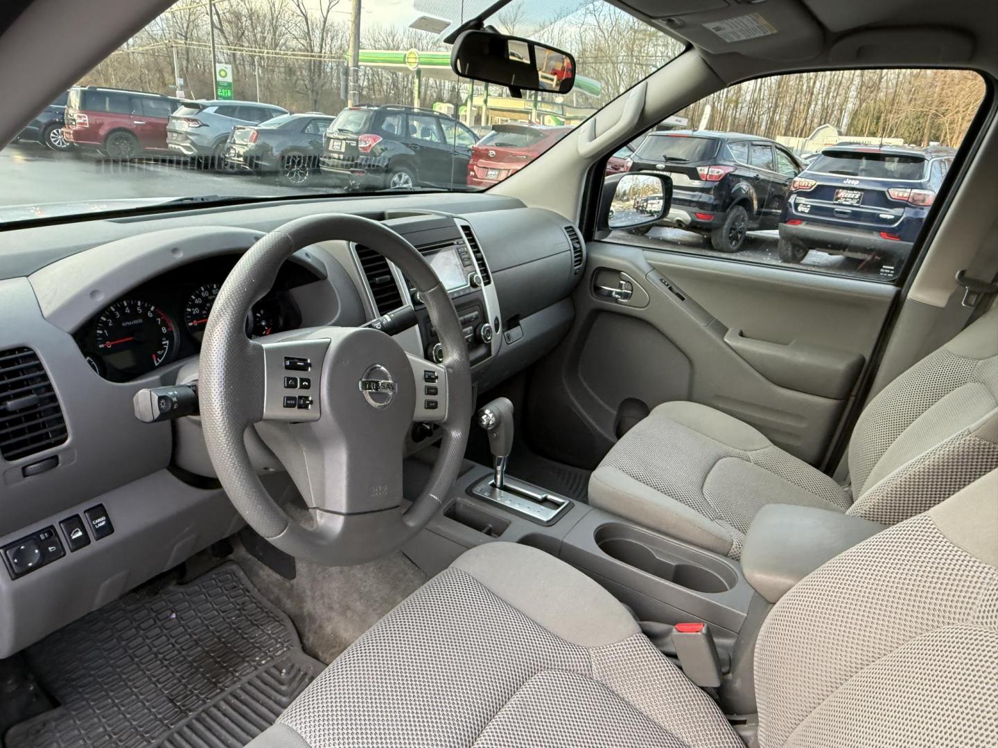 2017 White /Gray Nissan Frontier SV Crew Cab 5AT 4WD (1N6AD0EV5HN) with an 4.0L V6 DOHC 24V engine, Automatic transmission, located at 11115 Chardon Rd. , Chardon, OH, 44024, (440) 214-9705, 41.580246, -81.241943 - 2017 Nissan Frontier SV Crew Cab 4WD – Rugged Capability, Modern Convenience, and Proven Reliability Take on any road or job with confidence in this 2017 Nissan Frontier SV Crew Cab 4WD. Powered by a robust 4.0L V6 engine and a smooth 5-speed automatic transmission, this truck delivers the musc - Photo#3