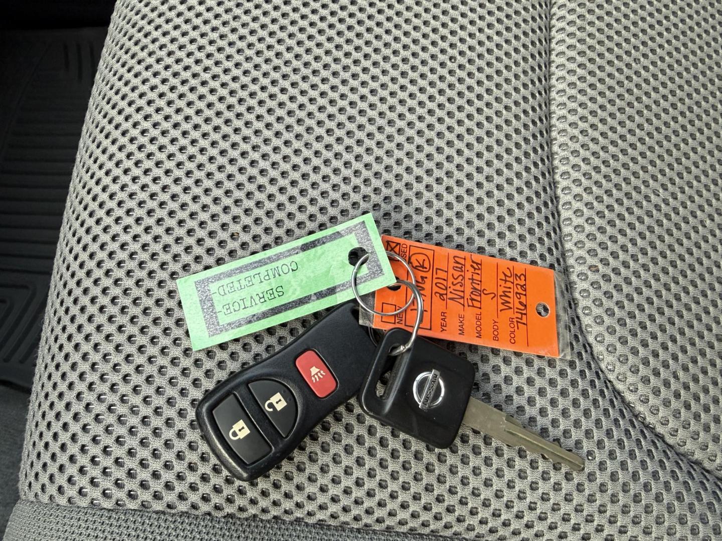 2017 White /Gray Nissan Frontier SV Crew Cab 5AT 4WD (1N6AD0EV5HN) with an 4.0L V6 DOHC 24V engine, Automatic transmission, located at 11115 Chardon Rd. , Chardon, OH, 44024, (440) 214-9705, 41.580246, -81.241943 - 2017 Nissan Frontier SV Crew Cab 4WD – Rugged Capability, Modern Convenience, and Proven Reliability Take on any road or job with confidence in this 2017 Nissan Frontier SV Crew Cab 4WD. Powered by a robust 4.0L V6 engine and a smooth 5-speed automatic transmission, this truck delivers the musc - Photo#23