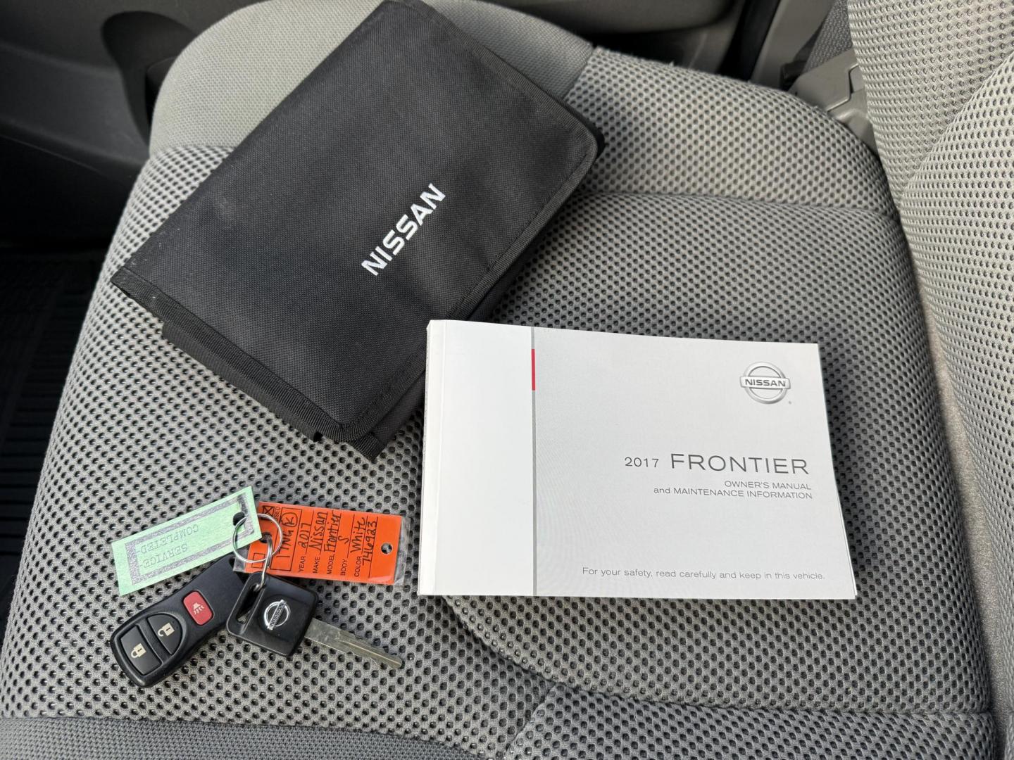 2017 White /Gray Nissan Frontier SV Crew Cab 5AT 4WD (1N6AD0EV5HN) with an 4.0L V6 DOHC 24V engine, Automatic transmission, located at 11115 Chardon Rd. , Chardon, OH, 44024, (440) 214-9705, 41.580246, -81.241943 - 2017 Nissan Frontier SV Crew Cab 4WD – Rugged Capability, Modern Convenience, and Proven Reliability Take on any road or job with confidence in this 2017 Nissan Frontier SV Crew Cab 4WD. Powered by a robust 4.0L V6 engine and a smooth 5-speed automatic transmission, this truck delivers the musc - Photo#24