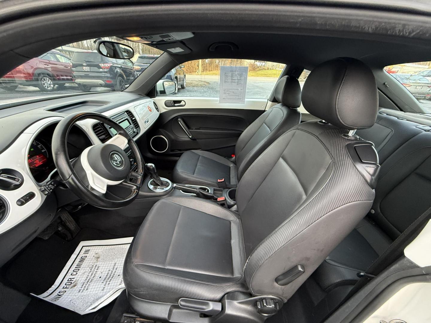 2012 White /Black Volkswagen New Beetle 2.5L (3VWJP7AT9CM) with an 2.5L I5 DOHC 20V engine, Automatic transmission, located at 11115 Chardon Rd. , Chardon, OH, 44024, (440) 214-9705, 41.580246, -81.241943 - 2012 Volkswagen Beetle – Iconic Style, Modern Comfort, and Standout Personality Drive home in classic style with this 2012 Volkswagen Beetle! Powered by a reliable 2.5L I5 engine and a smooth 6-speed automatic transmission, this Beetle blends timeless charm with everyday practicality. The eye-c - Photo#12