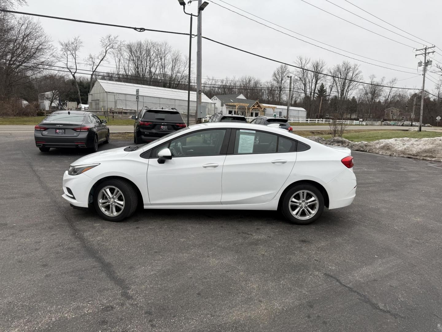 2017 White /Black Chevrolet Cruze LT Auto (1G1BE5SM7H7) with an 1.4L I4 DOHC 16V TURBO engine, Automatic transmission, located at 11115 Chardon Rd. , Chardon, OH, 44024, (440) 214-9705, 41.580246, -81.241943 - 2017 Chevrolet Cruze LT – Exceptional Fuel Economy, Modern Features, and Comfortable Driving Experience efficient and stylish driving with this 2017 Chevrolet Cruze LT. Powered by a spirited 1.4L turbocharged EcoTec engine paired with a smooth 6-speed automatic transmission, this sedan provides - Photo#24