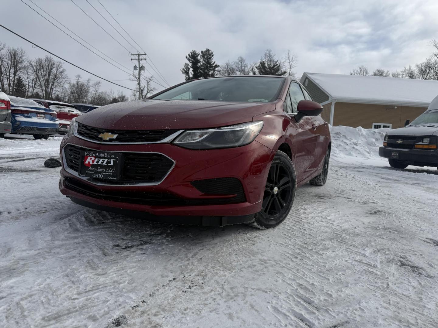 2017 Red /Black Chevrolet Cruze LT Auto (3G1BE5SM3HS) with an 1.4L I4 DOHC 16V TURBO engine, Automatic transmission, located at 11115 Chardon Rd. , Chardon, OH, 44024, (440) 214-9705, 41.580246, -81.241943 - Photo#0
