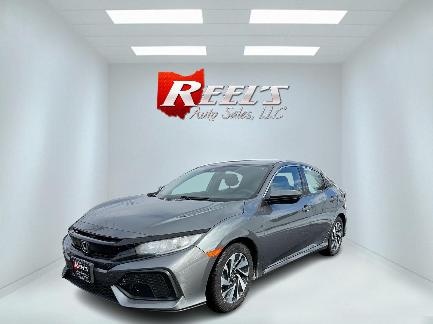 2019 Gray /Black Honda Civic LX CVT (SHHFK7H35KU) with an 1.5L I4 DOHC 16V Turbo engine, Automatic transmission, located at 547 E. Main St., Orwell, OH, 44076, (440) 437-5893, 41.535435, -80.847855 - 2019 Honda Civic LX Hatch – Turbocharged Efficiency, Sporty Style, and Everyday Practicality Enjoy the perfect combination of performance, efficiency, and versatility with this 2019 Honda Civic LX Hatch. Powered by a lively 1.5L I4 Turbocharged Earthdreams engine, this hatchback offers spirited - Photo#1