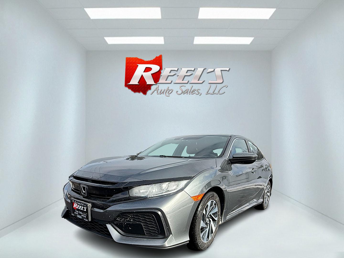 2019 Gray /Black Honda Civic LX CVT (SHHFK7H35KU) with an 1.5L I4 DOHC 16V Turbo engine, Automatic transmission, located at 547 E. Main St., Orwell, OH, 44076, (440) 437-5893, 41.535435, -80.847855 - 2019 Honda Civic LX Hatch – Turbocharged Efficiency, Sporty Style, and Everyday Practicality Enjoy the perfect combination of performance, efficiency, and versatility with this 2019 Honda Civic LX Hatch. Powered by a lively 1.5L I4 Turbocharged Earthdreams engine, this hatchback offers spirited - Photo#0