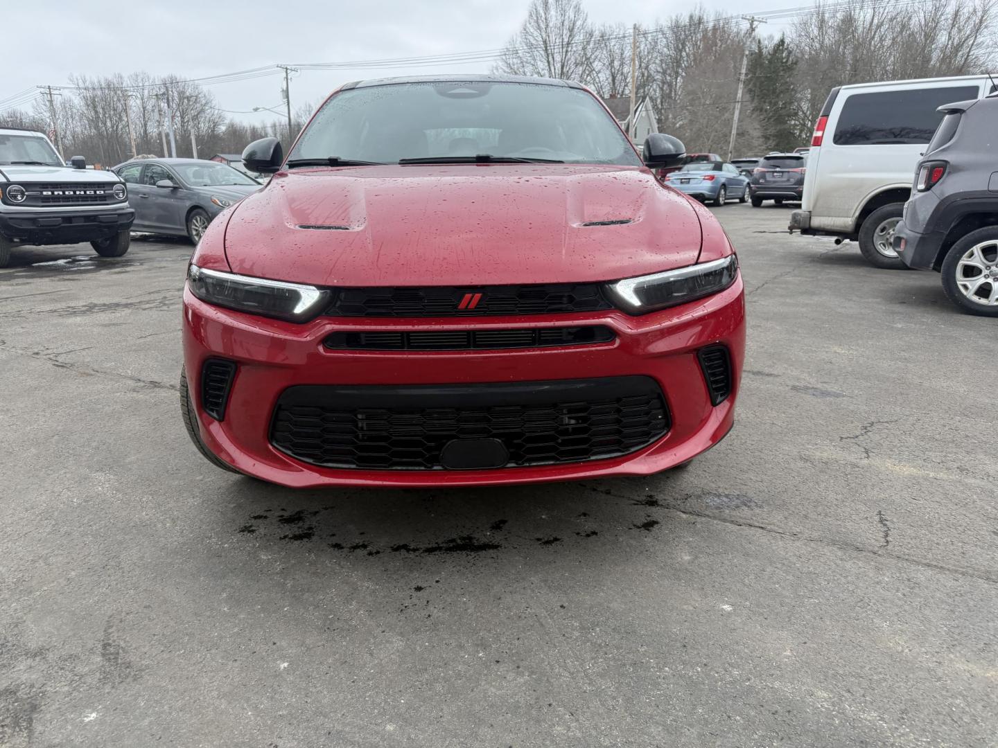 2024 Red /Black Dodge Hornet GT Plus AWD (ZACNDFAN6R3) with an 2.0L I4 DOHC 16V Turbo engine, Automatic transmission, located at 547 E. Main St., Orwell, OH, 44076, (440) 437-5893, 41.535435, -80.847855 - BOOM! Get ready to fall in love with this incredible 2024 Dodge Hornet GT Plus AWD – it's pure excitement wrapped in one amazing package! This beauty is powered by a thrilling 2.0L Turbocharged Hurricane I4 engine delivering 268 horsepower and 295 lb-ft of torque for instant grin-inducing acceler - Photo#1