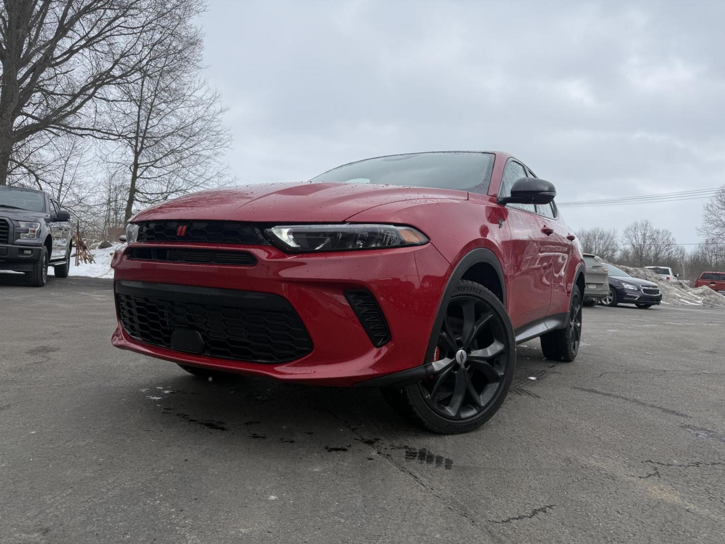 2024 Red /Black Dodge Hornet GT Plus AWD (ZACNDFAN6R3) with an 2.0L I4 DOHC 16V Turbo engine, Automatic transmission, located at 547 E. Main St., Orwell, OH, 44076, (440) 437-5893, 41.535435, -80.847855 - BOOM! Get ready to fall in love with this incredible 2024 Dodge Hornet GT Plus AWD – it's pure excitement wrapped in one amazing package! This beauty is powered by a thrilling 2.0L Turbocharged Hurricane I4 engine delivering 268 horsepower and 295 lb-ft of torque for instant grin-inducing acceler - Photo#0