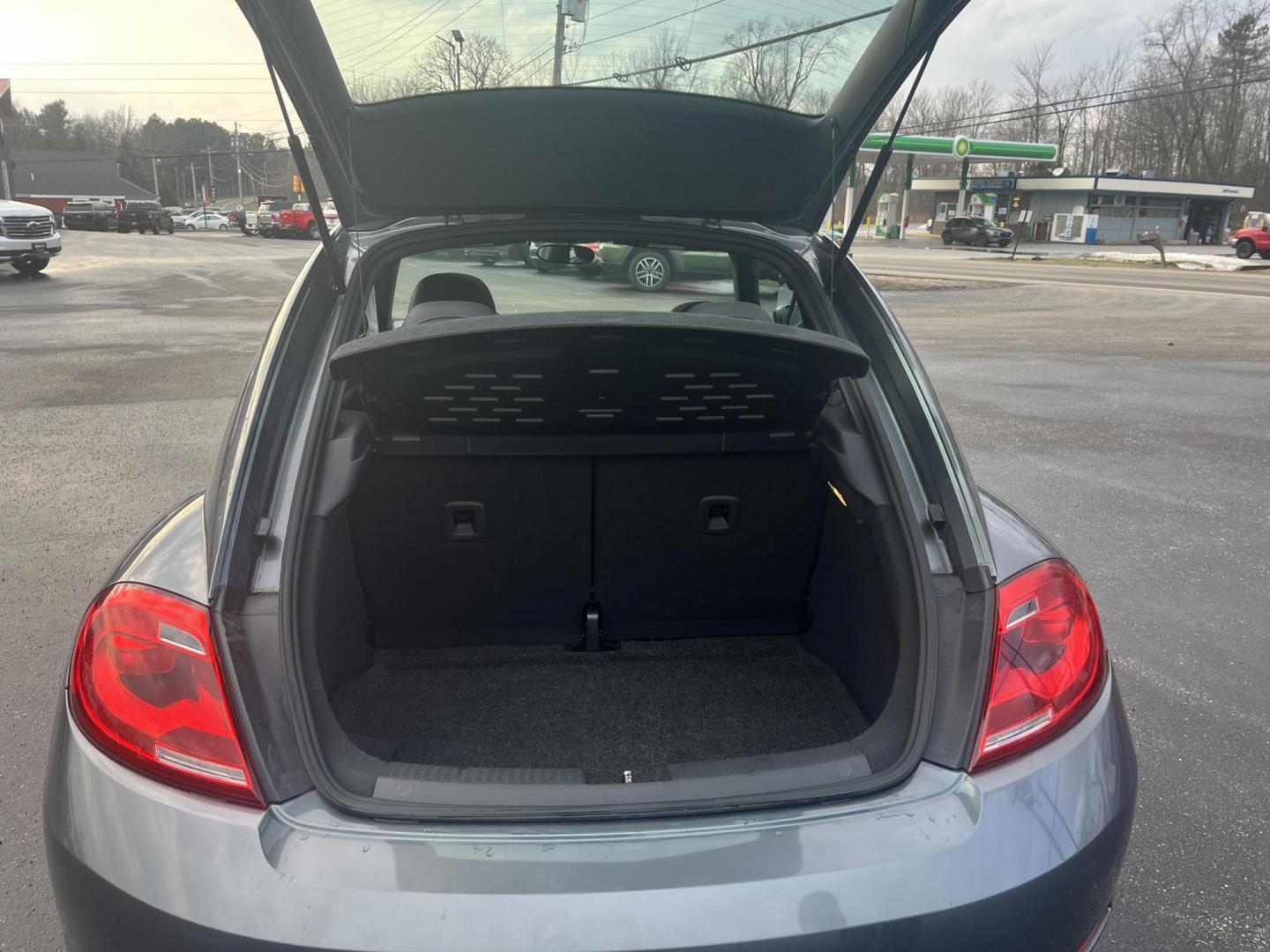 2015 Gray /Black Volkswagen Beetle 1.8T (3VWJ17ATXFM) with an 1.8L I4 DOHC 16V Turbo engine, Automatic transmission, located at 11115 Chardon Rd. , Chardon, OH, 44024, (440) 214-9705, 41.580246, -81.241943 - 2015 Volkswagen Beetle 1.8T – Iconic Style, Turbo Kick, and Pure Fun on Every Drive! This timeless 2015 Volkswagen Beetle 1.8T is ready to turn heads and put a smile on your face! Powered by a peppy 1.8L Turbocharged I4 engine paired with a smooth 6-speed automatic transmission, it delivers livel - Photo#11
