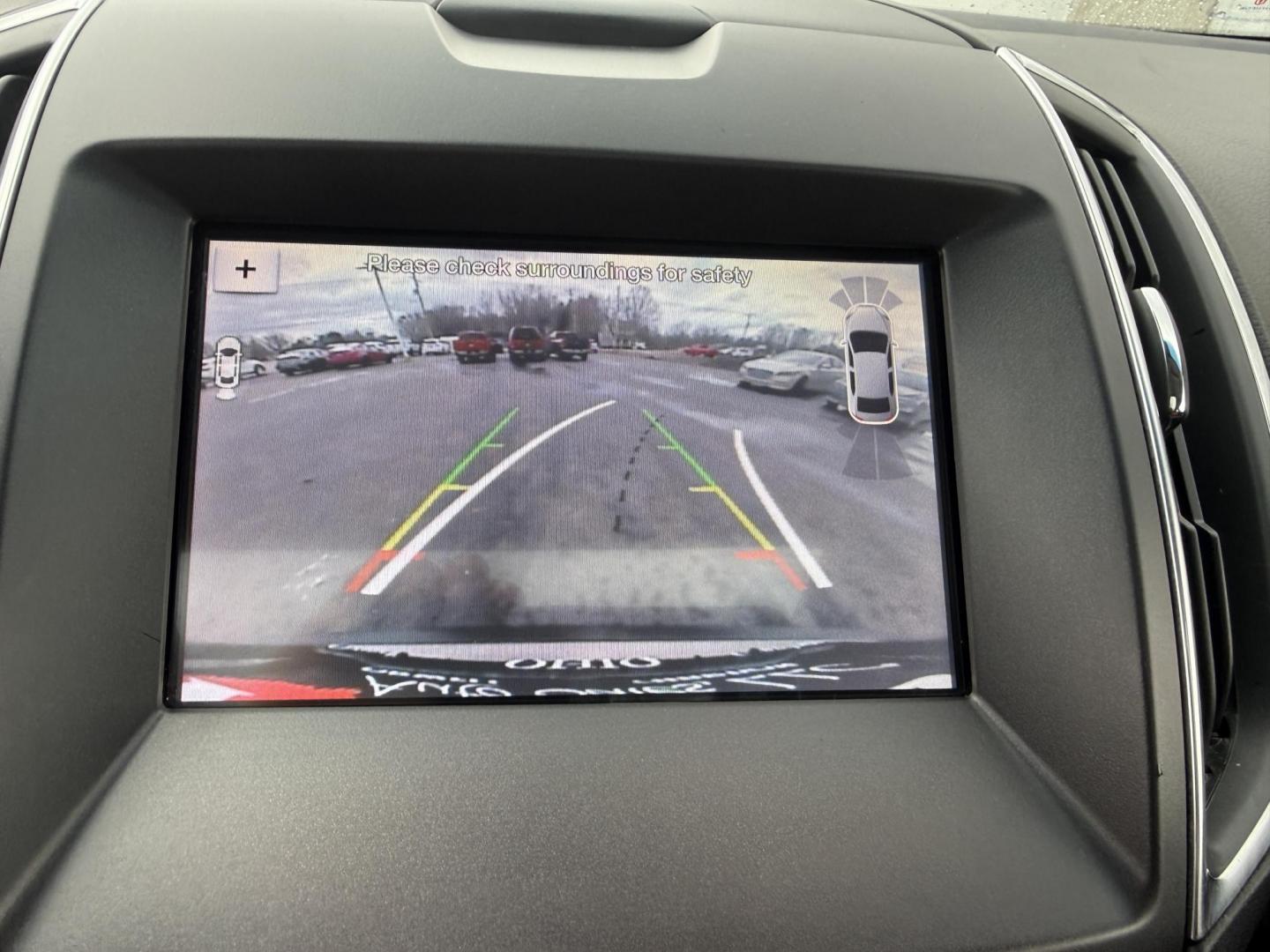 2019 Gray Ford Edge Titanium AWD (2FMPK4K99KB) with an 2.0L L4 DOHC 16V Turbo engine, Automatic transmission, located at 547 E. Main St., Orwell, OH, 44076, (440) 437-5893, 41.535435, -80.847855 - 2019 Ford Edge Titanium AWD – Top-Tier Luxury, Turbo Thrills, and Every Premium Feature You Crave! This 2019 Ford Edge Titanium AWD is loaded to the gills and ready to elevate every drive! The responsive 2.0L Turbocharged EcoBoost I4 engine teams up with a slick 8-speed automatic transmission and - Photo#18