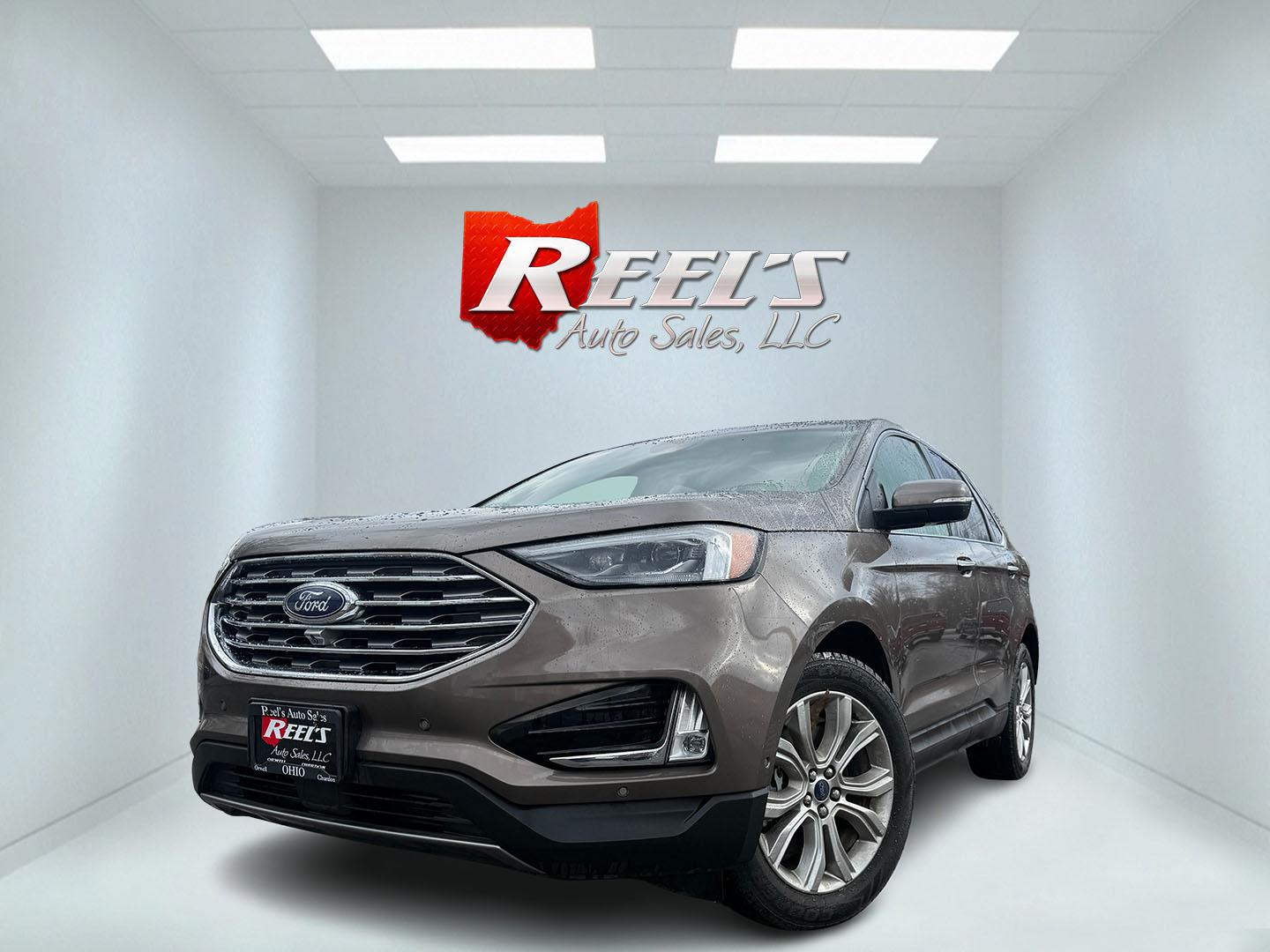 2019 Gray Ford Edge Titanium AWD (2FMPK4K99KB) with an 2.0L L4 DOHC 16V Turbo engine, Automatic transmission, located at 547 E. Main St., Orwell, OH, 44076, (440) 437-5893, 41.535435, -80.847855 - 2019 Ford Edge Titanium AWD – Top-Tier Luxury, Turbo Thrills, and Every Premium Feature You Crave! This 2019 Ford Edge Titanium AWD is loaded to the gills and ready to elevate every drive! The responsive 2.0L Turbocharged EcoBoost I4 engine teams up with a slick 8-speed automatic transmission and - Photo#0