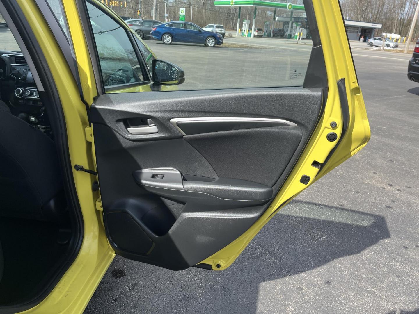 2015 Yellow /Black Honda Fit LX (3HGGK5H56FM) with an 1.5L I4 DOHC 16V engine, Automatic transmission, located at 11115 Chardon Rd. , Chardon, OH, 44024, (440) 214-9705, 41.580246, -81.241943 - 2015 Honda Fit LX – Super-Efficient Hatchback with Fun Personality and Eye-Catching Style! This zippy 2015 Honda Fit LX is the ultimate smart buy for anyone wanting maximum fun, space, and fuel savings in a compact package! Powered by Honda’s reliable 1.5L I4 Earth Dreams engine, it delivers pe - Photo#27