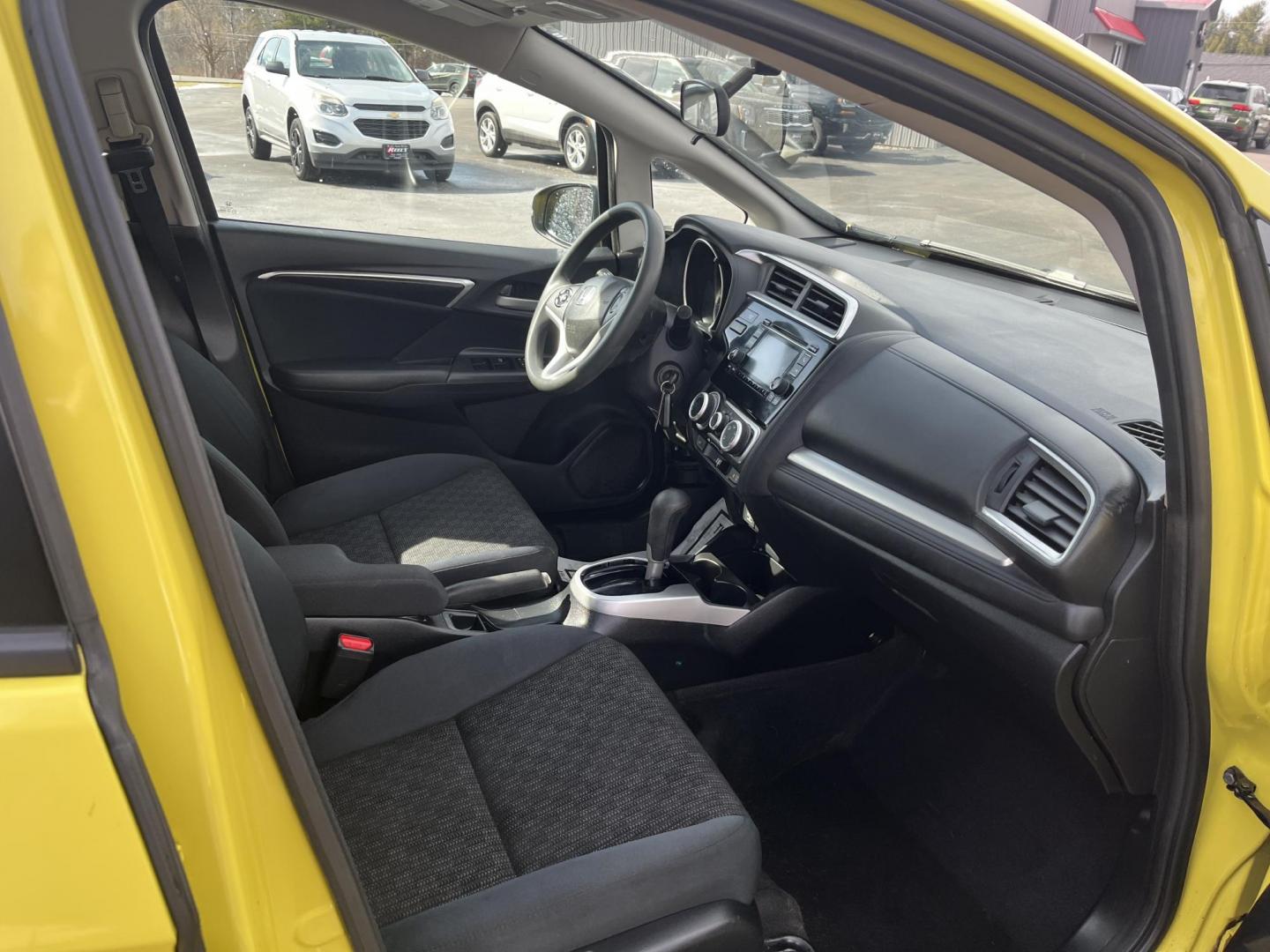 2015 Yellow /Black Honda Fit LX (3HGGK5H56FM) with an 1.5L I4 DOHC 16V engine, Automatic transmission, located at 11115 Chardon Rd. , Chardon, OH, 44024, (440) 214-9705, 41.580246, -81.241943 - 2015 Honda Fit LX – Super-Efficient Hatchback with Fun Personality and Eye-Catching Style! This zippy 2015 Honda Fit LX is the ultimate smart buy for anyone wanting maximum fun, space, and fuel savings in a compact package! Powered by Honda’s reliable 1.5L I4 Earth Dreams engine, it delivers pe - Photo#30