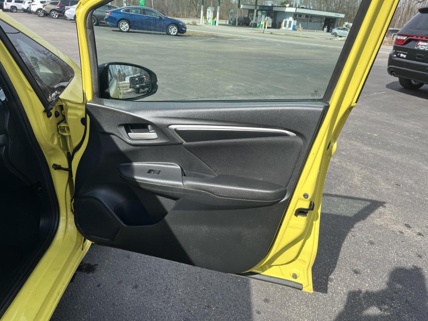 2015 Yellow /Black Honda Fit LX (3HGGK5H56FM) with an 1.5L I4 DOHC 16V engine, Automatic transmission, located at 11115 Chardon Rd. , Chardon, OH, 44024, (440) 214-9705, 41.580246, -81.241943 - 2015 Honda Fit LX – Super-Efficient Hatchback with Fun Personality and Eye-Catching Style! This zippy 2015 Honda Fit LX is the ultimate smart buy for anyone wanting maximum fun, space, and fuel savings in a compact package! Powered by Honda’s reliable 1.5L I4 Earth Dreams engine, it delivers pe - Photo#29