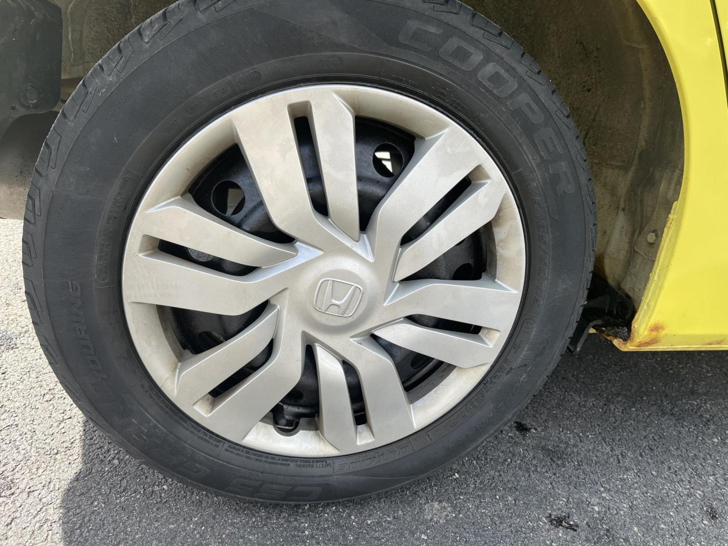 2015 Yellow /Black Honda Fit LX (3HGGK5H56FM) with an 1.5L I4 DOHC 16V engine, Automatic transmission, located at 11115 Chardon Rd. , Chardon, OH, 44024, (440) 214-9705, 41.580246, -81.241943 - 2015 Honda Fit LX – Super-Efficient Hatchback with Fun Personality and Eye-Catching Style! This zippy 2015 Honda Fit LX is the ultimate smart buy for anyone wanting maximum fun, space, and fuel savings in a compact package! Powered by Honda’s reliable 1.5L I4 Earth Dreams engine, it delivers pe - Photo#6