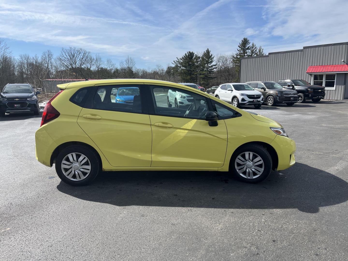 2015 Yellow /Black Honda Fit LX (3HGGK5H56FM) with an 1.5L I4 DOHC 16V engine, Automatic transmission, located at 11115 Chardon Rd. , Chardon, OH, 44024, (440) 214-9705, 41.580246, -81.241943 - 2015 Honda Fit LX – Super-Efficient Hatchback with Fun Personality and Eye-Catching Style! This zippy 2015 Honda Fit LX is the ultimate smart buy for anyone wanting maximum fun, space, and fuel savings in a compact package! Powered by Honda’s reliable 1.5L I4 Earth Dreams engine, it delivers pe - Photo#4