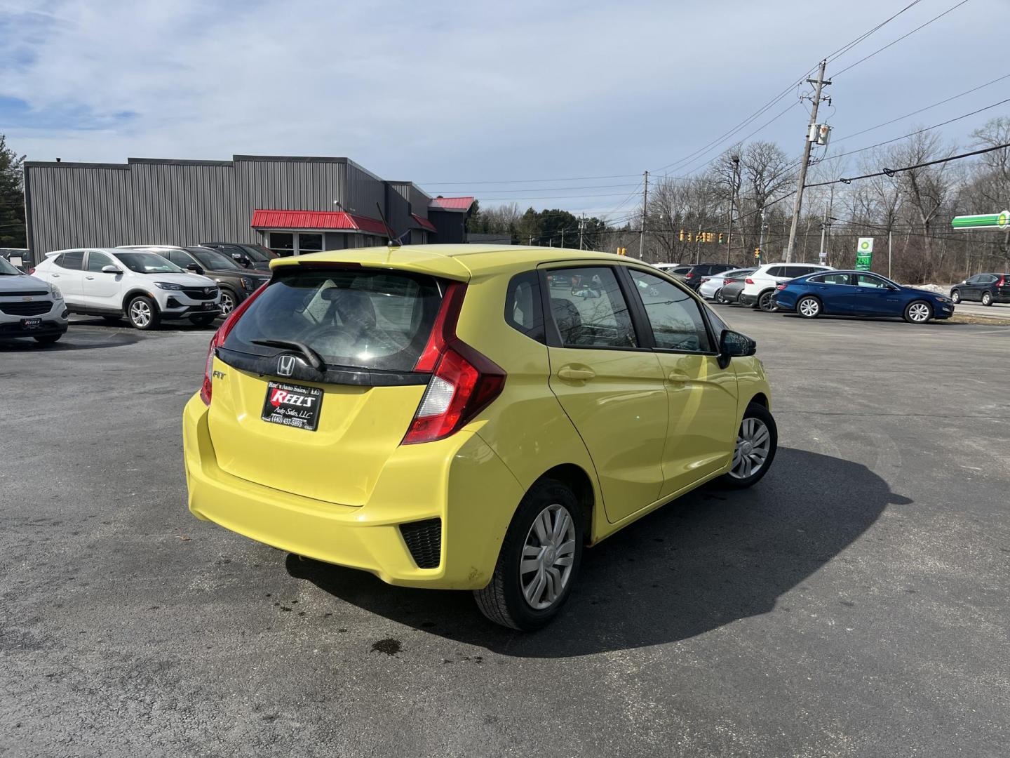 2015 Yellow /Black Honda Fit LX (3HGGK5H56FM) with an 1.5L I4 DOHC 16V engine, Automatic transmission, located at 11115 Chardon Rd. , Chardon, OH, 44024, (440) 214-9705, 41.580246, -81.241943 - 2015 Honda Fit LX – Super-Efficient Hatchback with Fun Personality and Eye-Catching Style! This zippy 2015 Honda Fit LX is the ultimate smart buy for anyone wanting maximum fun, space, and fuel savings in a compact package! Powered by Honda’s reliable 1.5L I4 Earth Dreams engine, it delivers pe - Photo#5